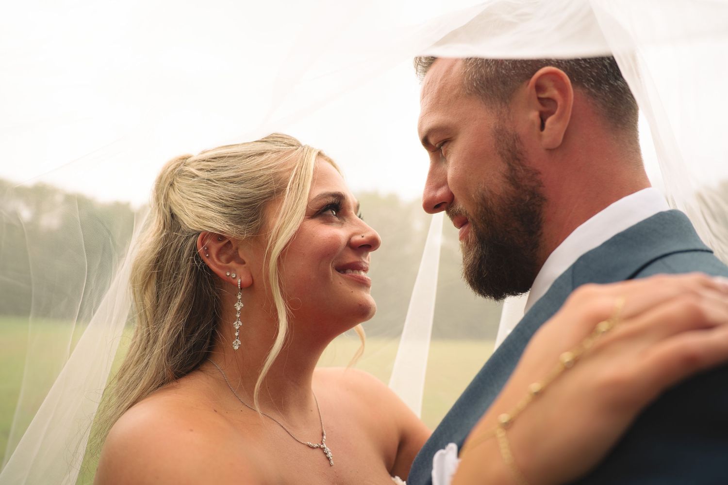 Intimate wedding portraits captured during golden hour with soft natural lighting.