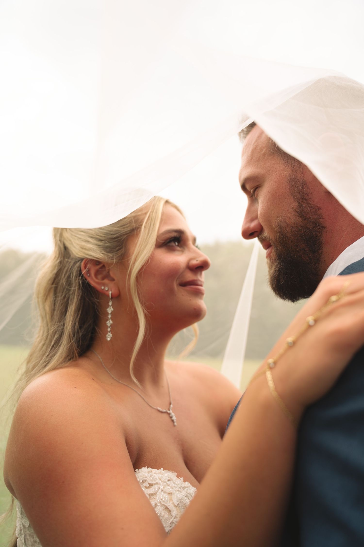 Intimate wedding portrait sequence showing tender moments between newlyweds.