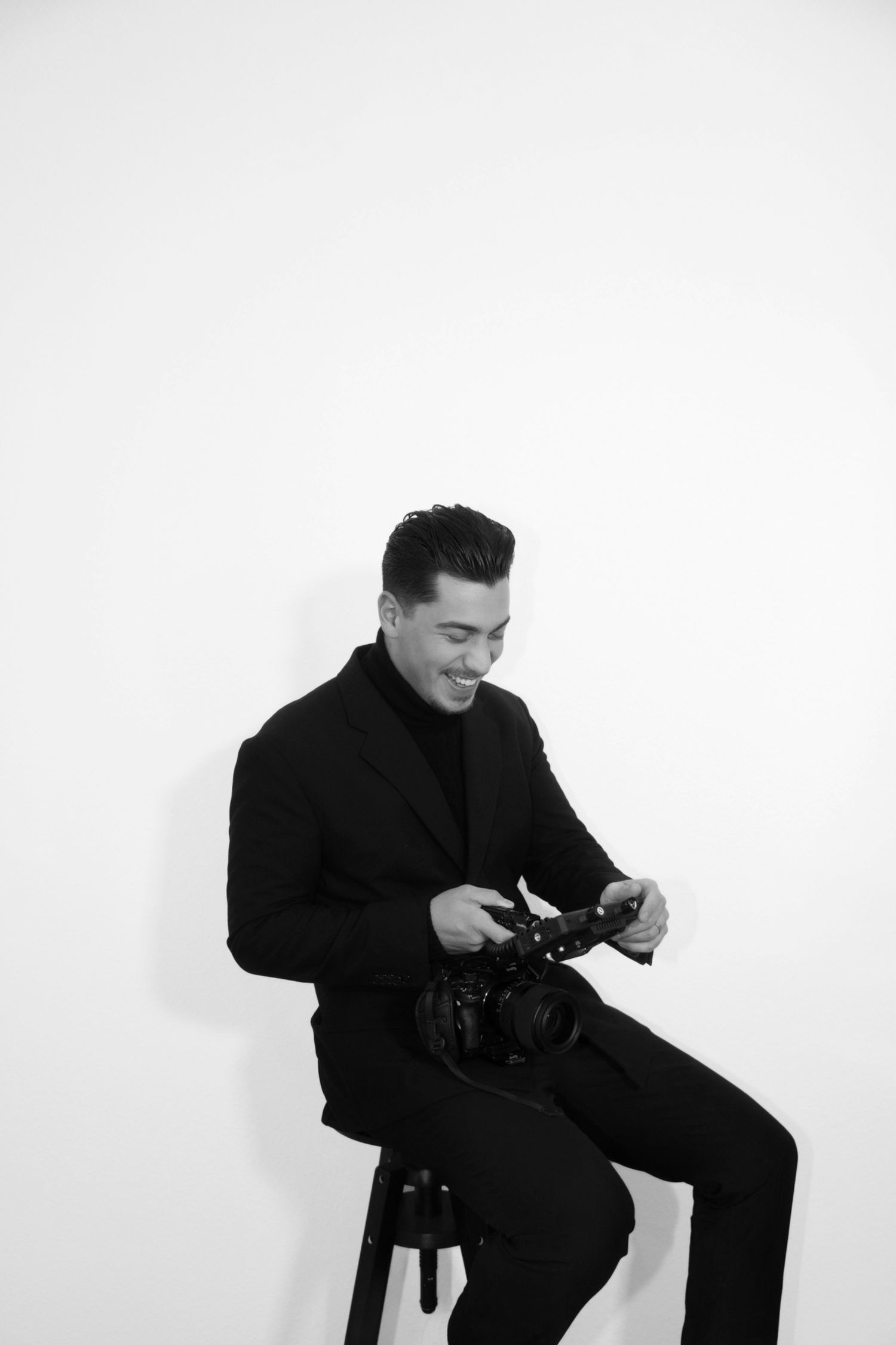 Series of candid shots showing photographer adjusting camera equipment while seated.
