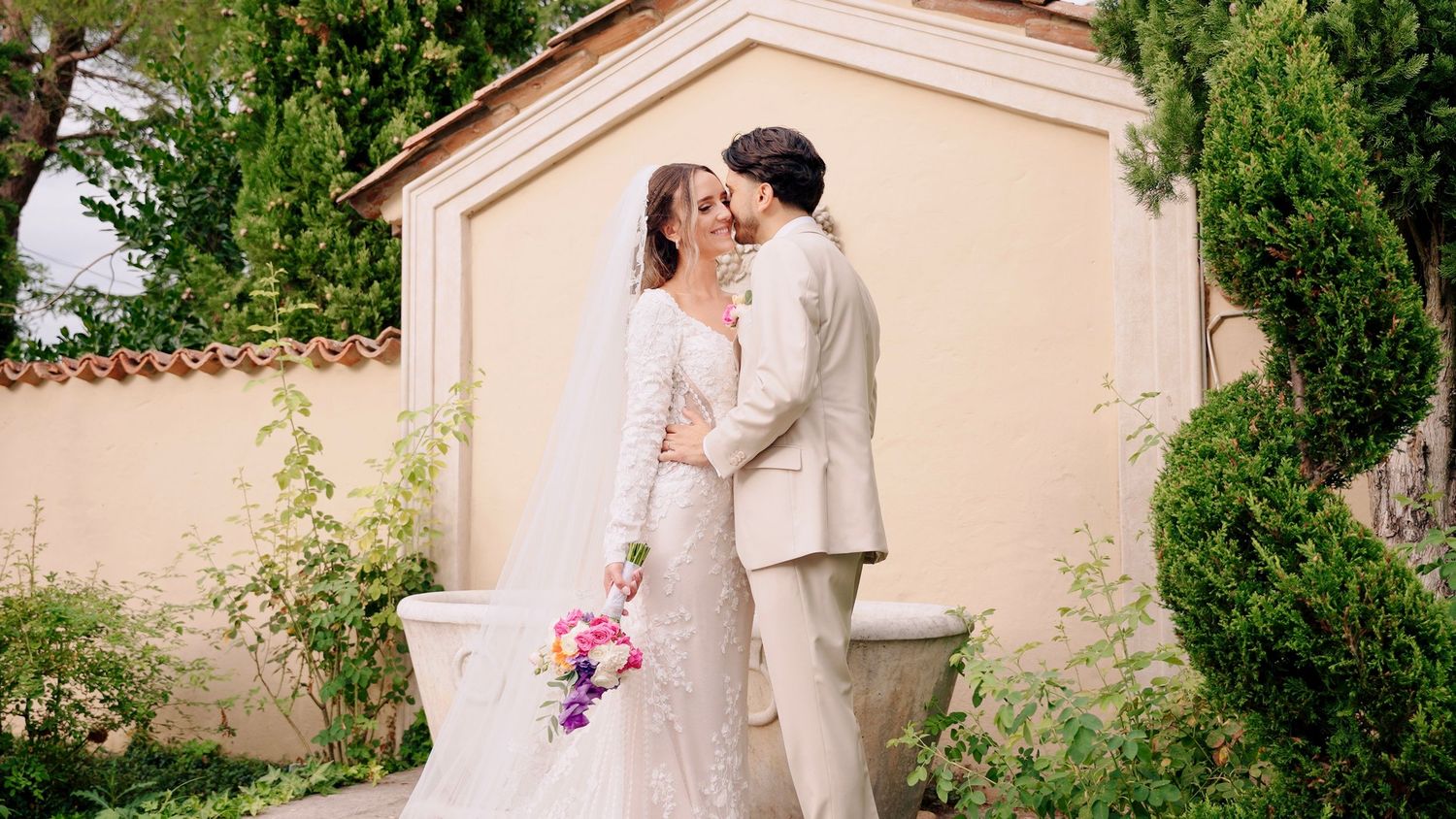 Panoramic view of a romantic outdoor wedding ceremony at an elegant venue.