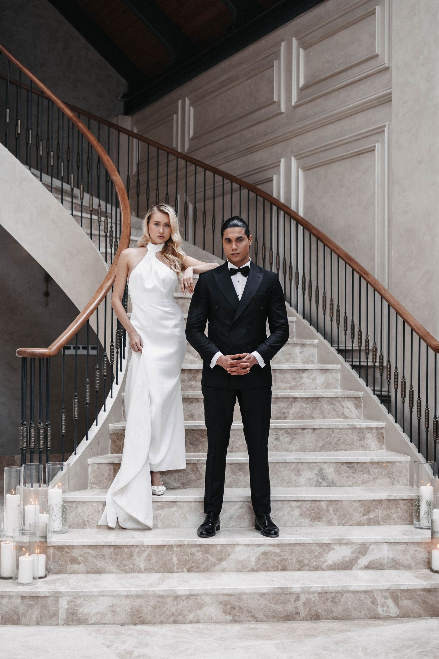 Creative wedding photography series showing couple interacting on grand marble staircase.