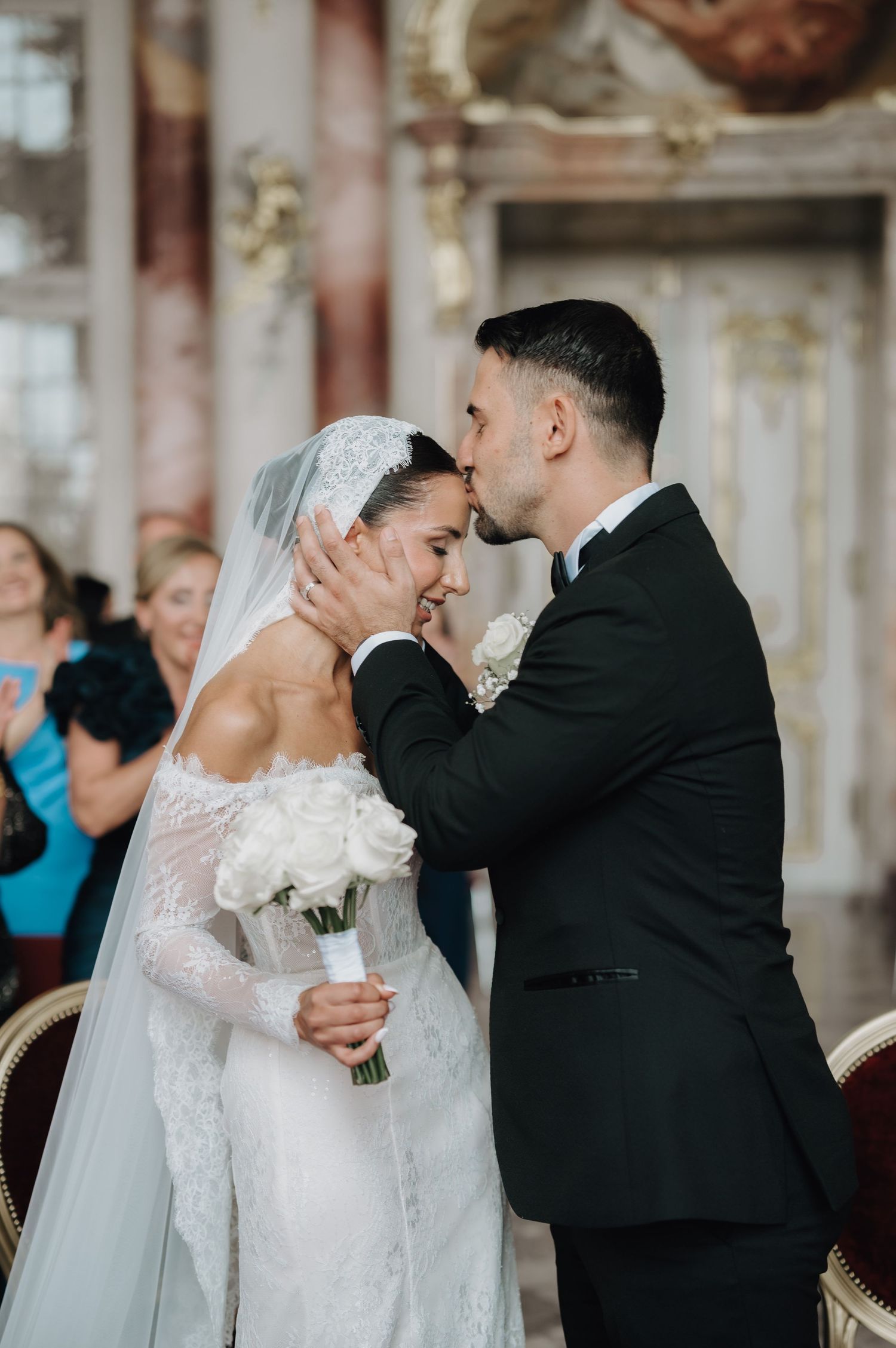 Romantic wedding ceremony moments captured in an ornate historic venue.