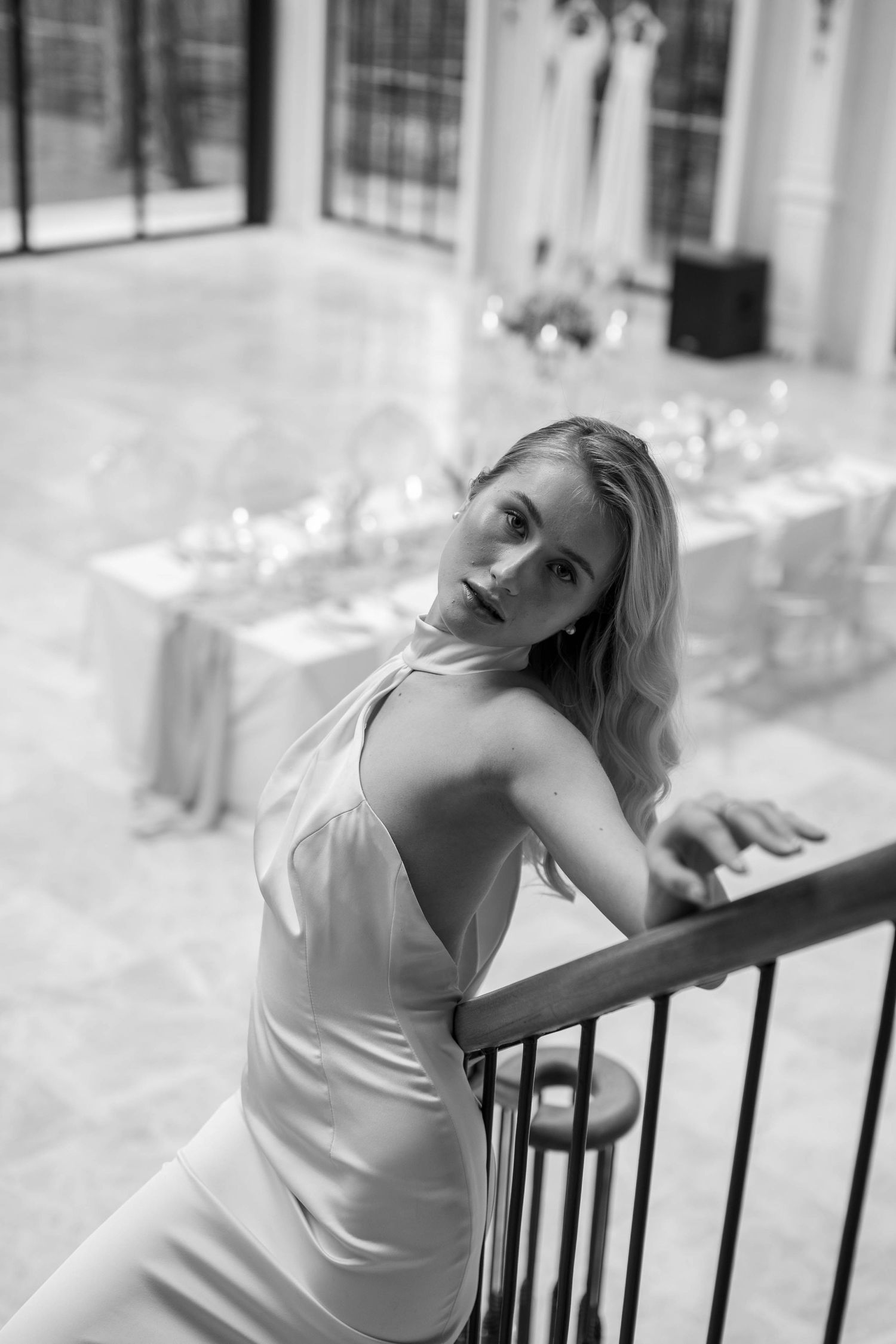 Ethereal black and white bridal portraits showcasing elegant poses against iron railings.