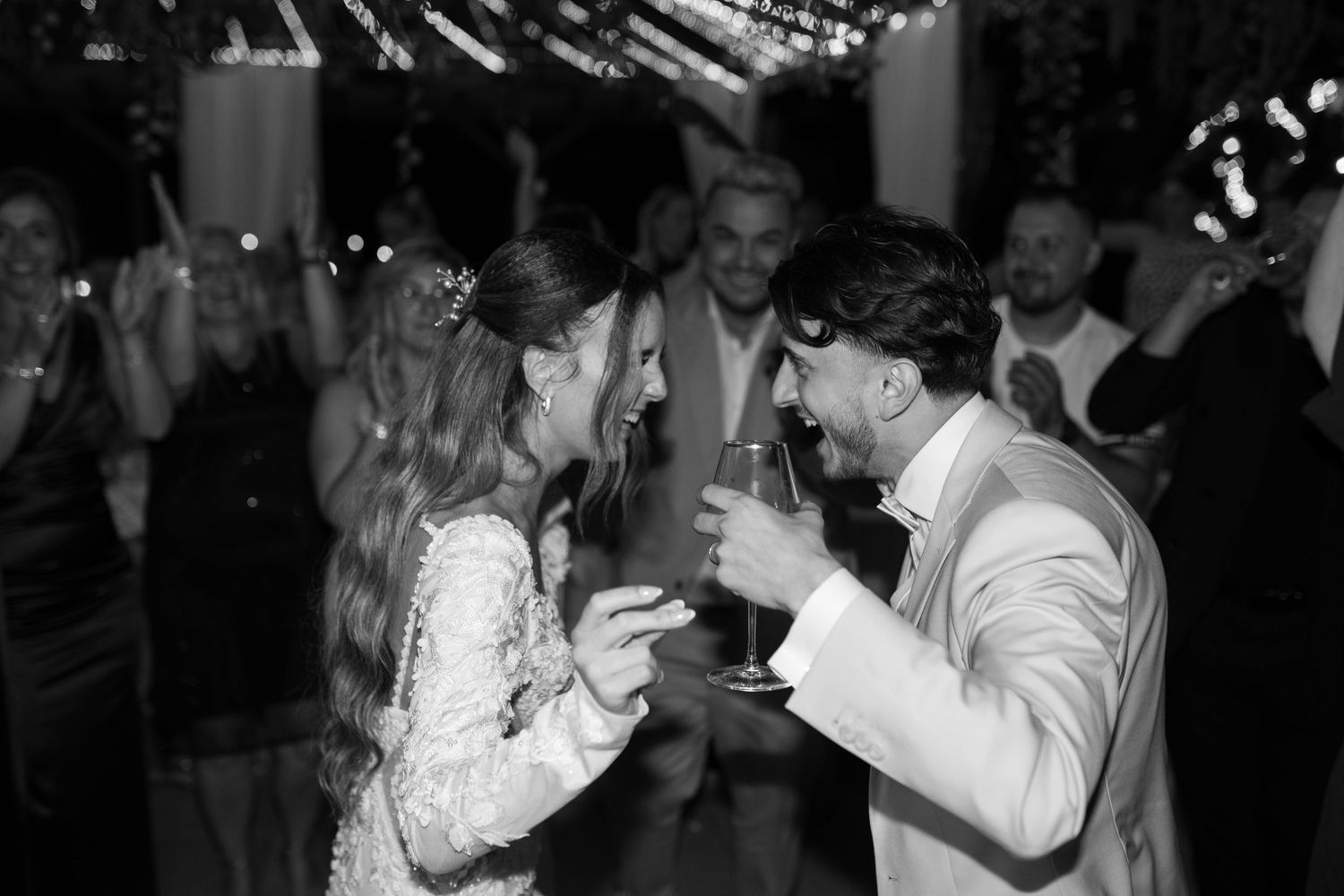 Romantic dance moments captured at evening wedding reception.