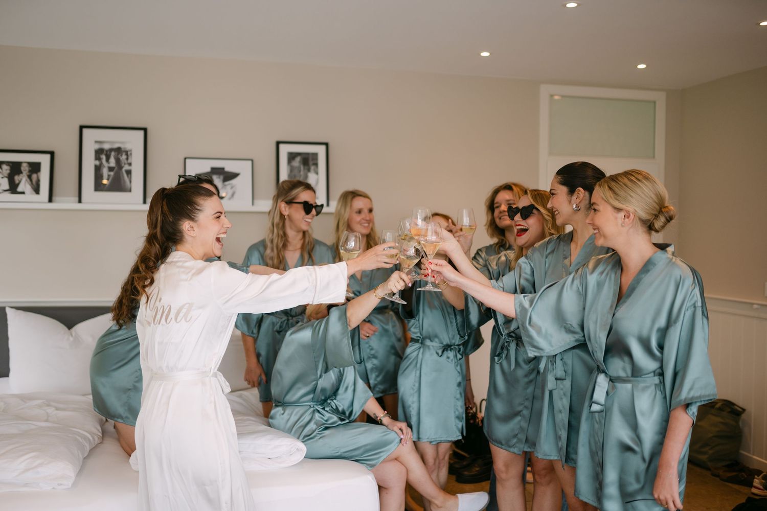 Wedding preparation scene with matching outfits in a bright interior setting.