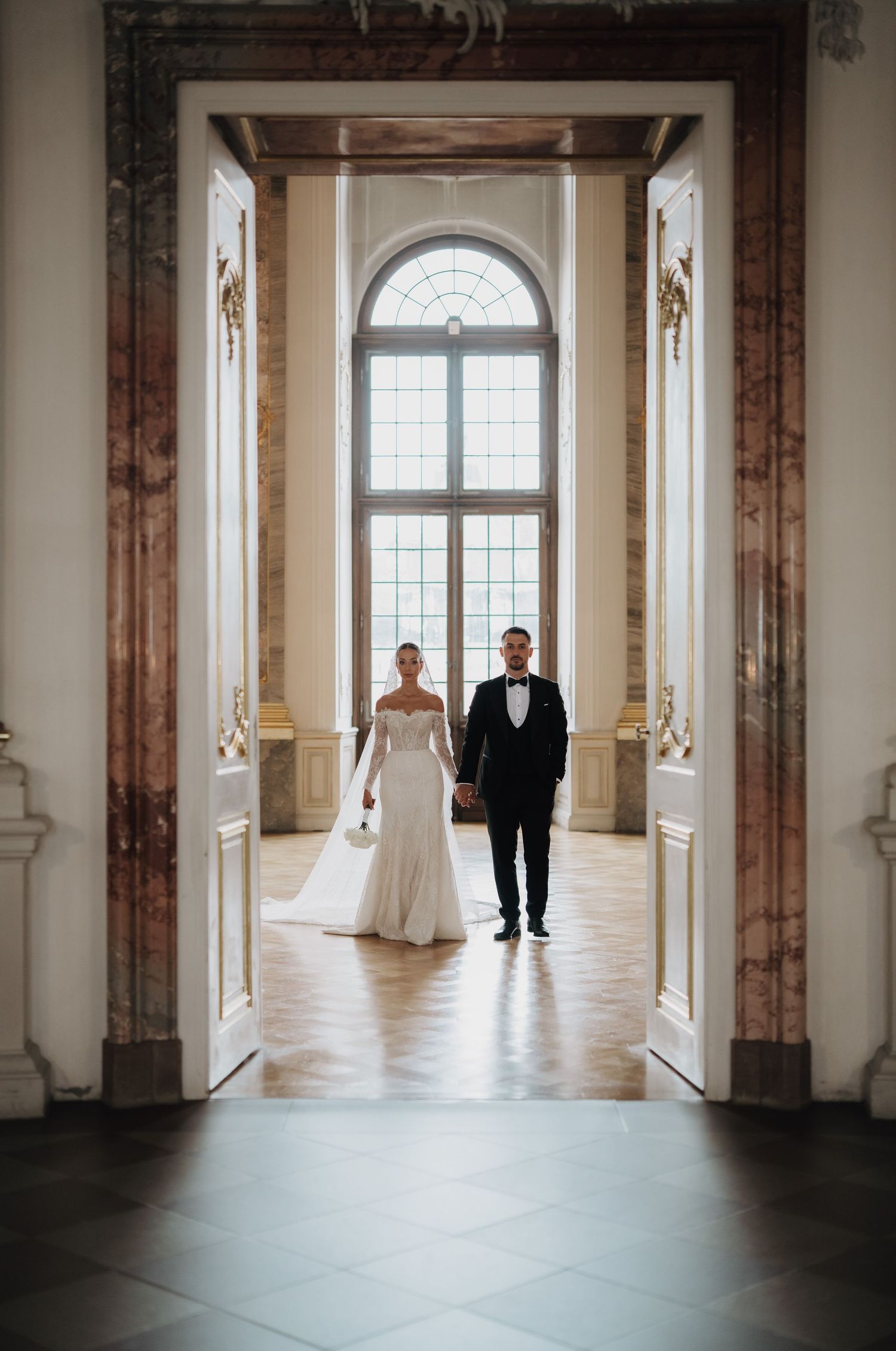 Wedding photography sequence in a grand marble hallway with natural light streaming through windows.