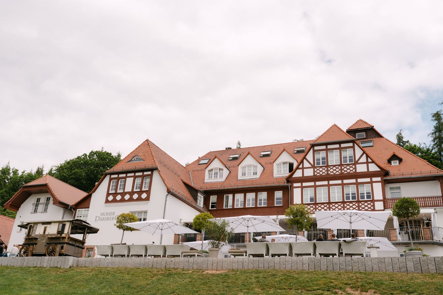 Panoramic view of traditional white buildings with red roofs in a European style resort complex.
