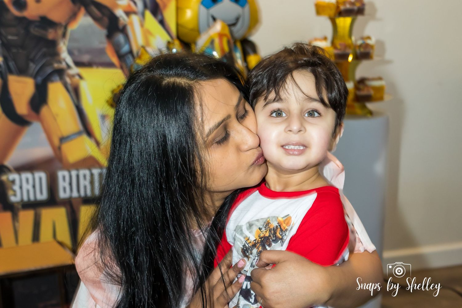 Candid moment captured as mom was kissing her son on his birthday, special moments, portraits