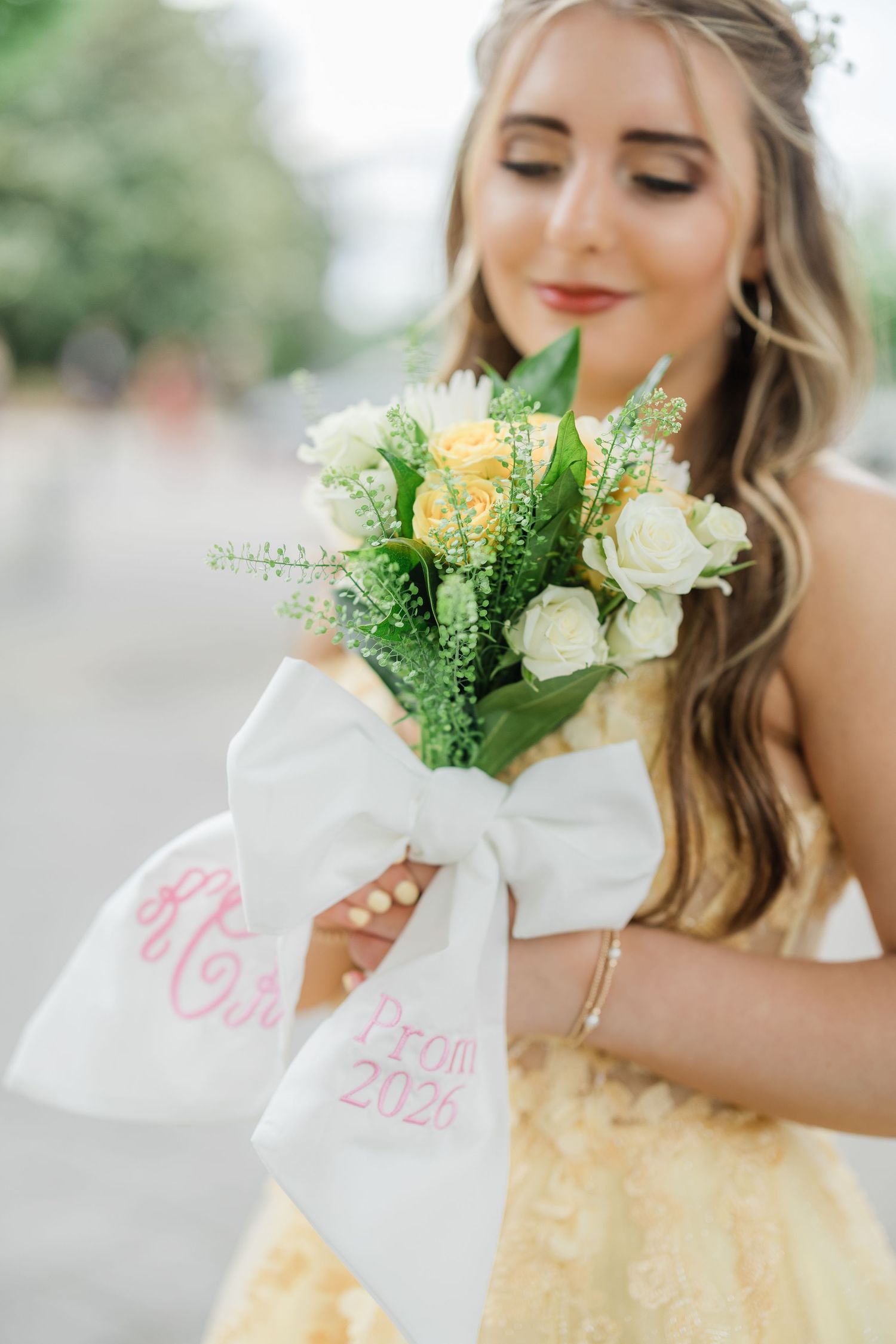 Senior Girl in Yellow Prom dress with monogramed bouquet