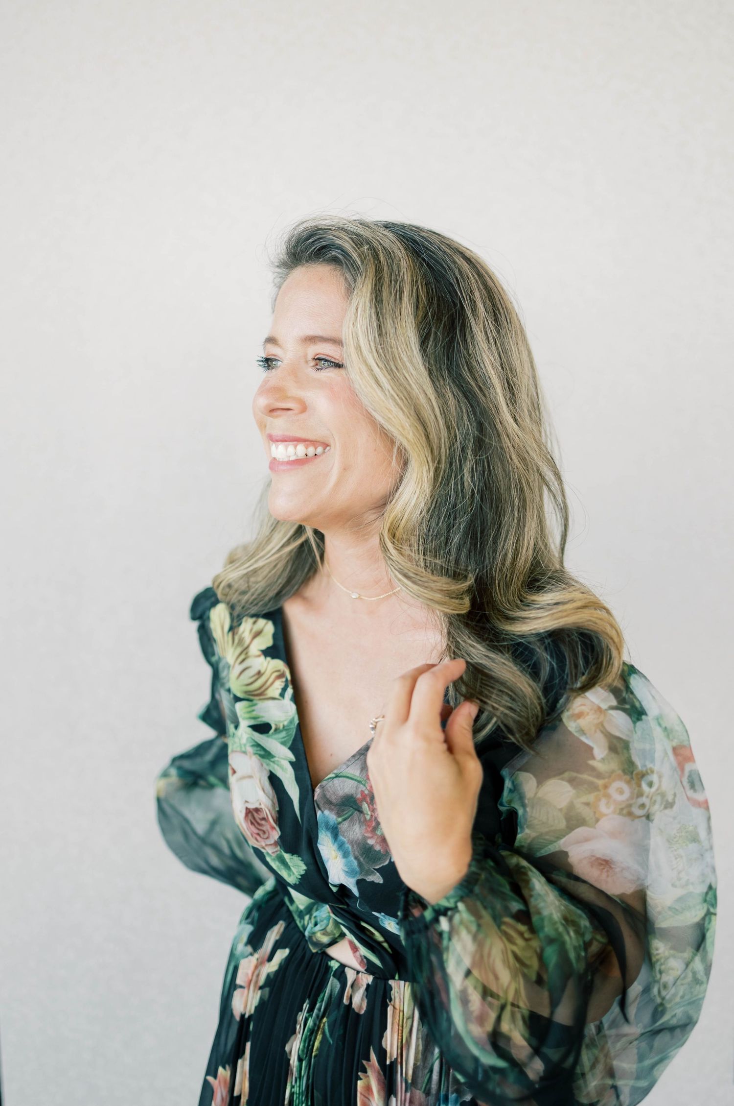 Headshot of Heather McClenahan Photography owner in Anthropologie dress.