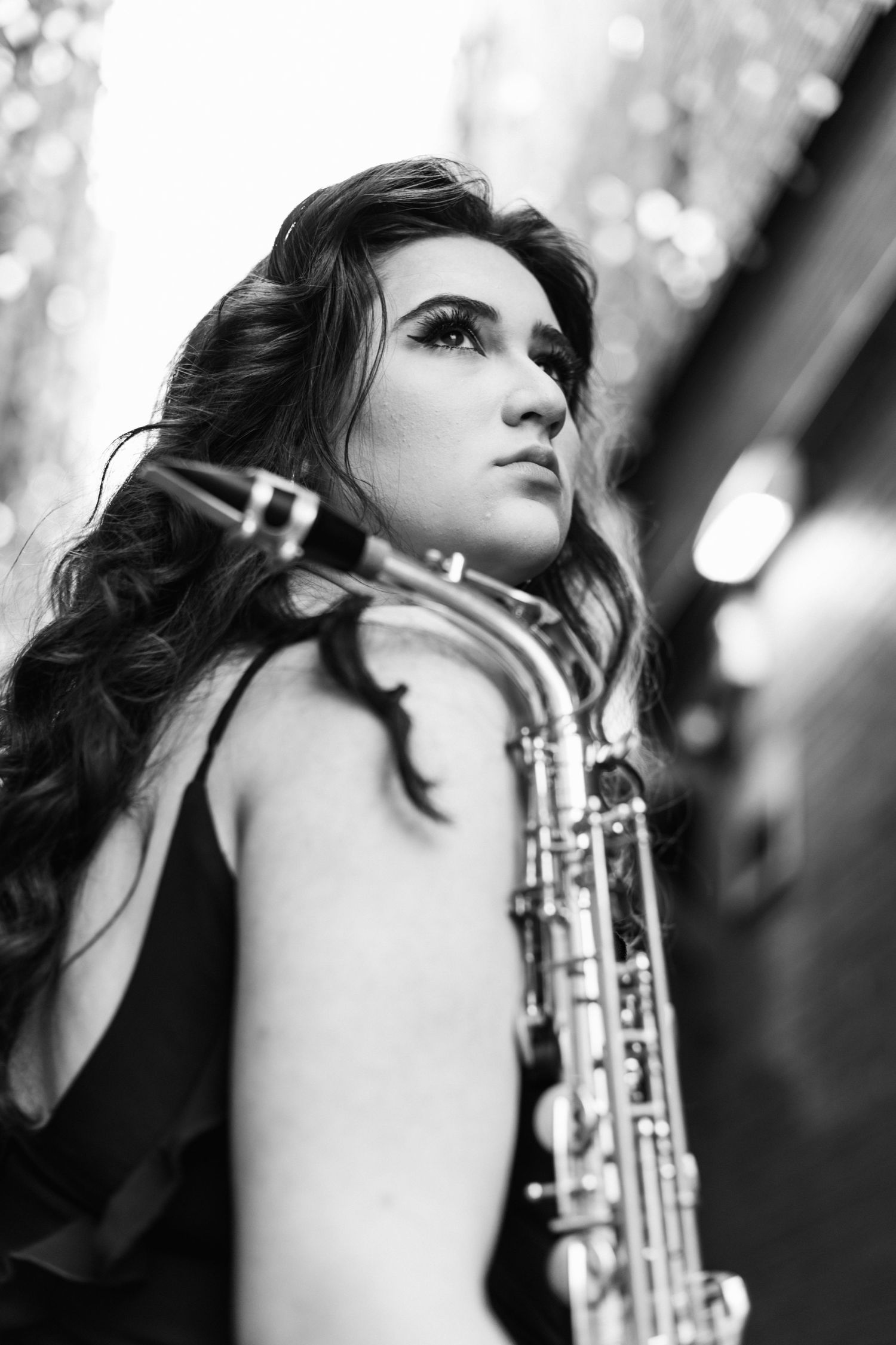 Black and white saxophone senior session in all black.