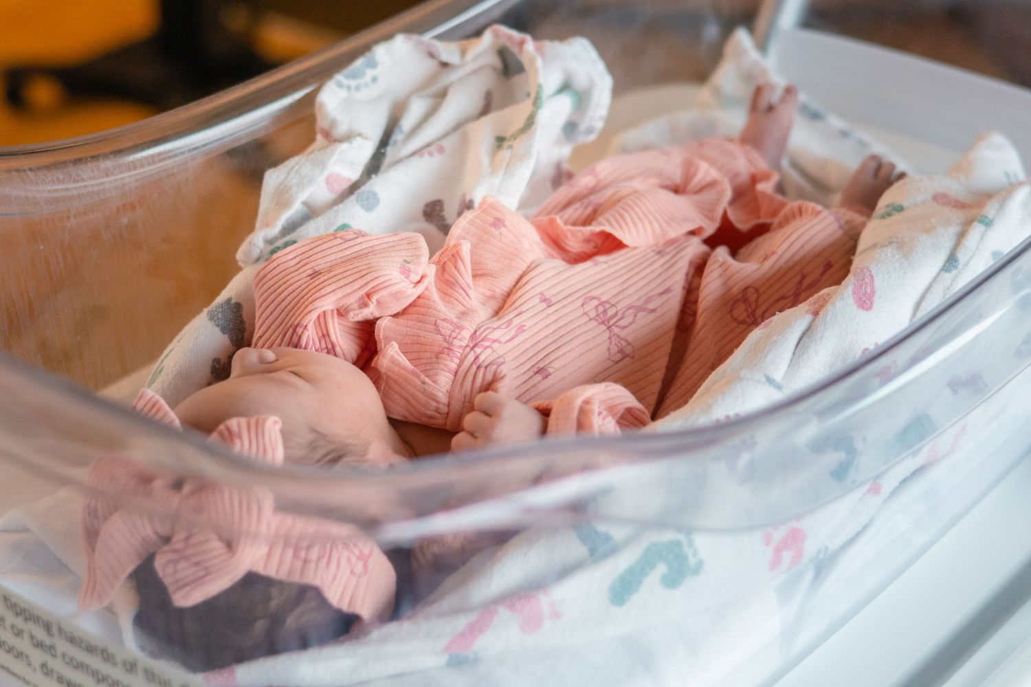 Close-up view of pink medical equipment in a clinical setting.