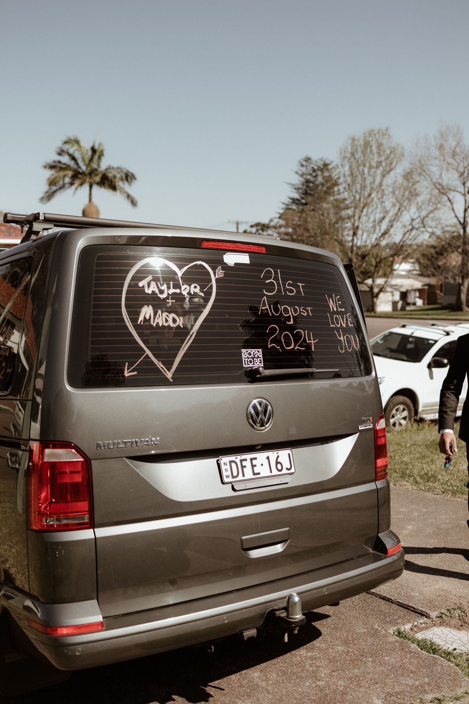 VW van rear window decorated with Taylor and Mason wedding date August 31st 2024 message.