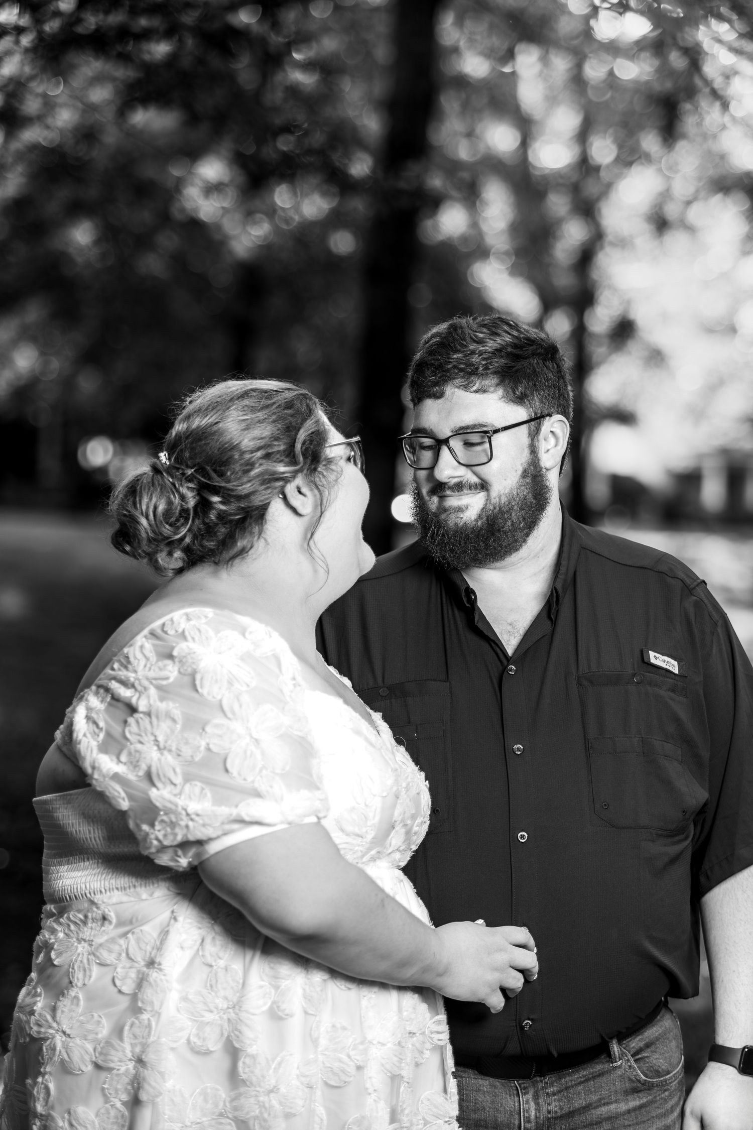 Black and white photo series showing an intimate moment between people in a romantic outdoor setting.