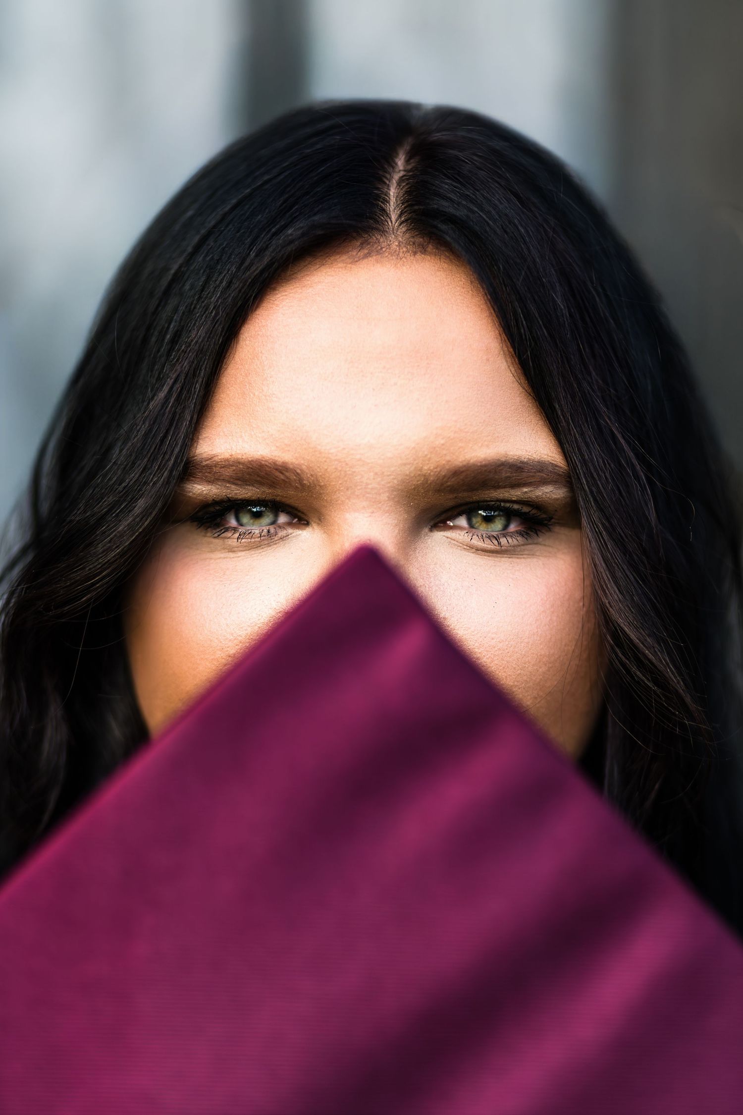 Creative portrait series showing gradually covered eyes with purple fabric, leaving only intense gaze visible in first frames.