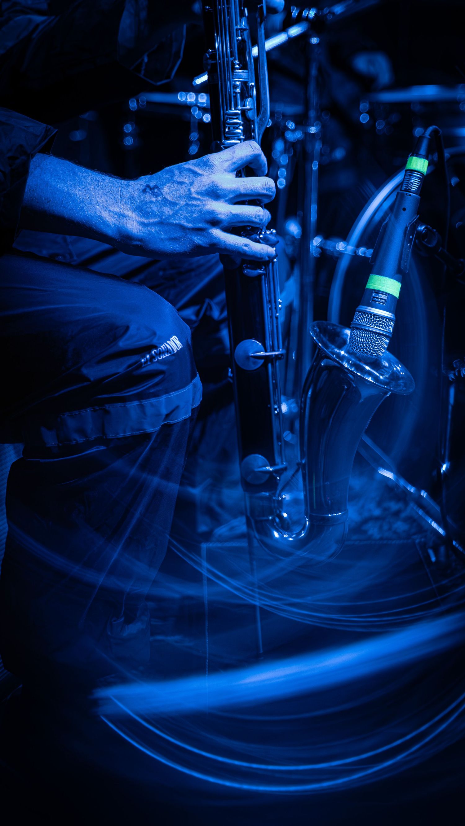 Close-up shots of a chemistry laboratory glass setup with blue lighting creating a dramatic scientific atmosphere.