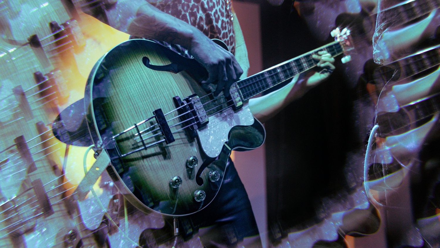 Colorful abstract banner showcasing silhouettes of musical instruments including electric guitars against a vibrant background.