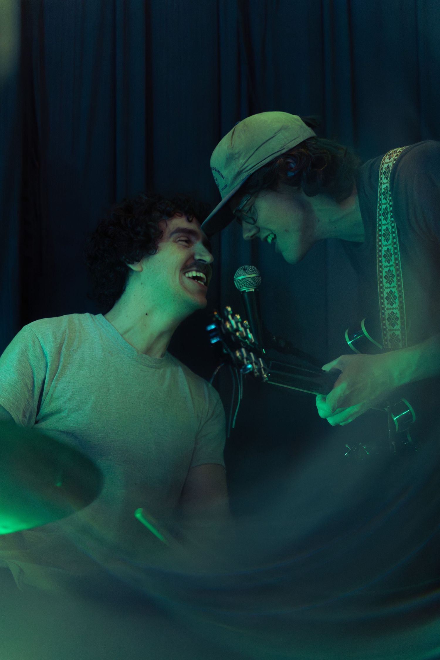 Sequence of images showing someone sleeping with a green tinted lighting effect creating a dark atmospheric mood.
