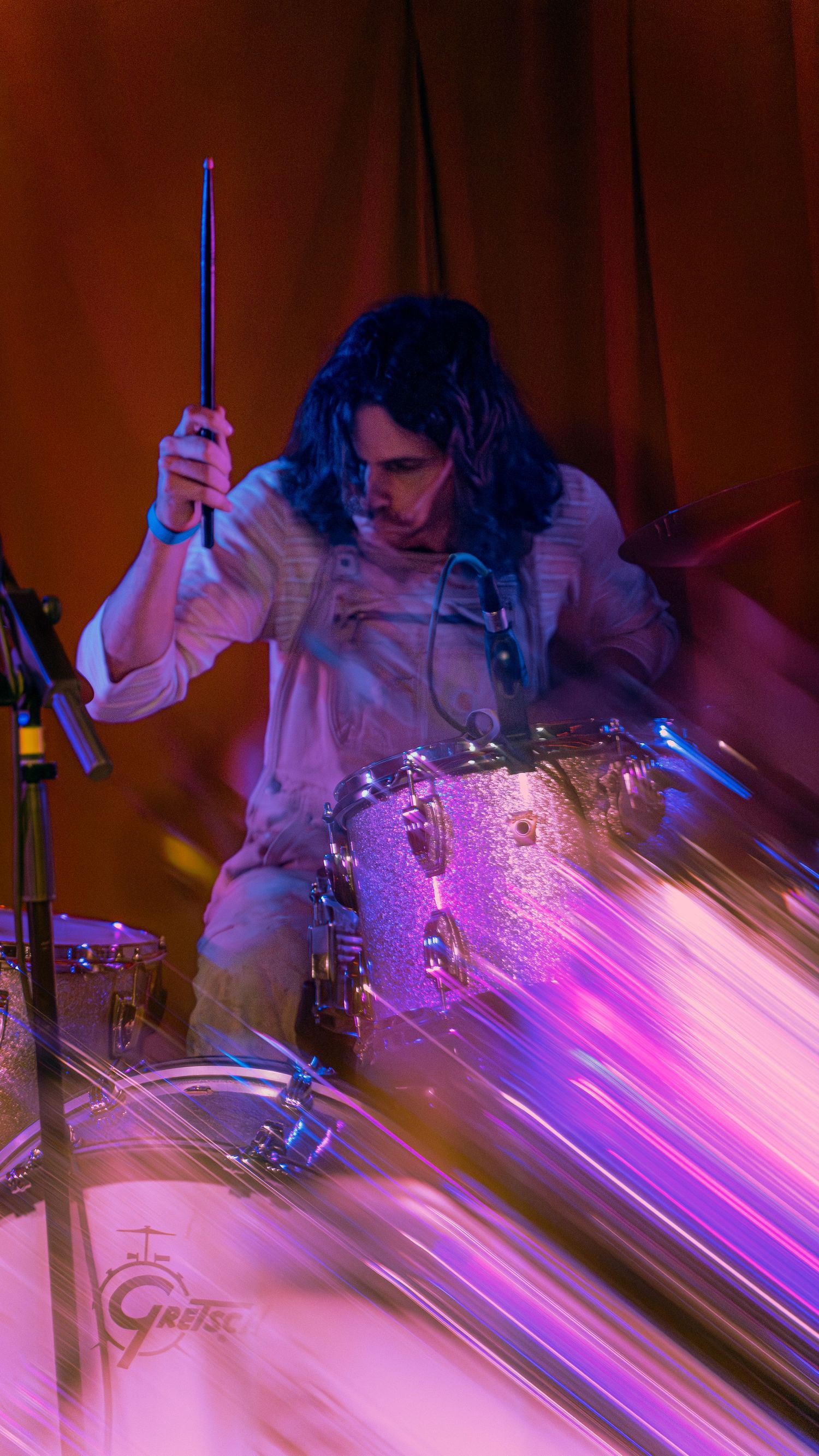 Scientists conduct research using glowing purple fluorescent material in a laboratory setting.