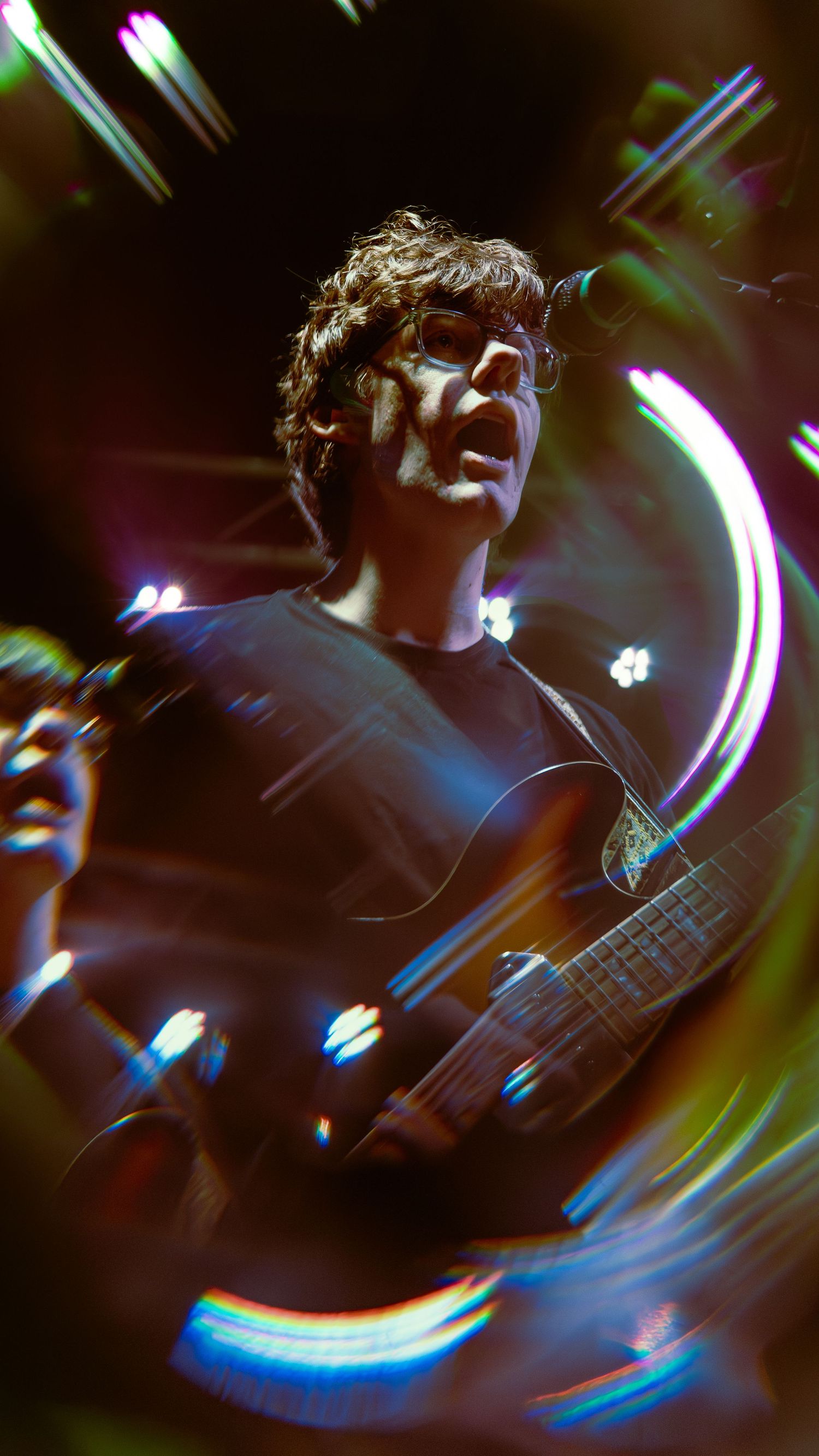 Abstract motion-blurred photo with dark and light streaks creating a dynamic swirling effect.
