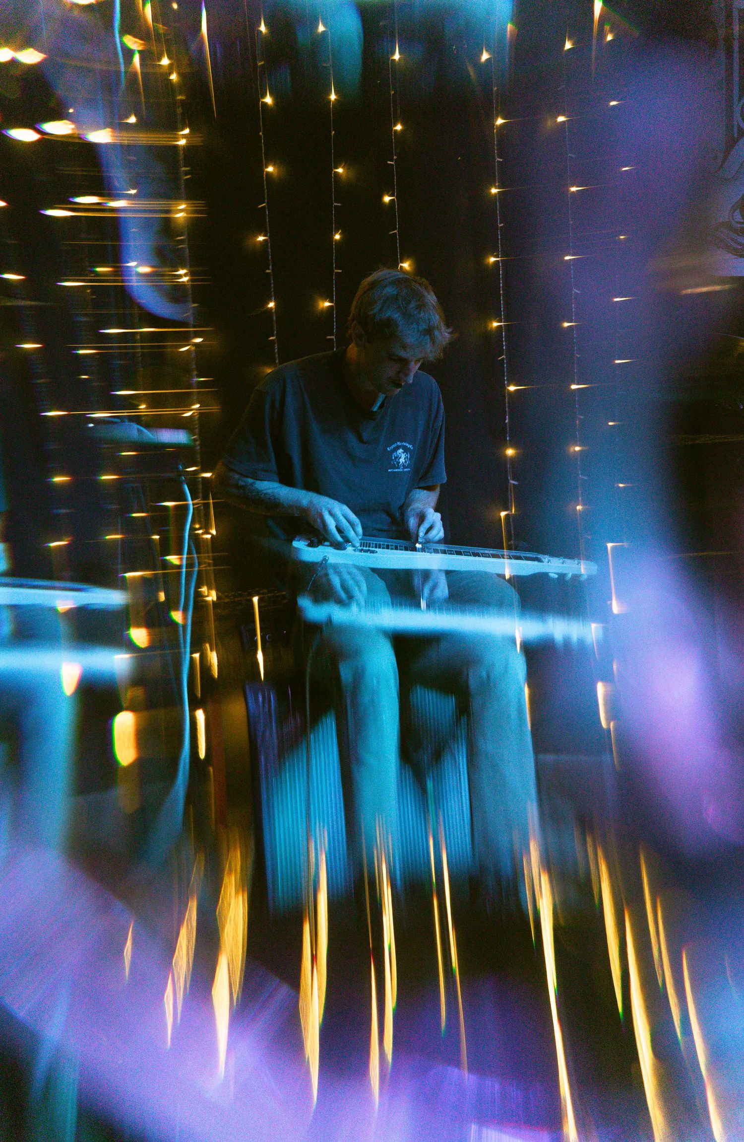 A series of blue and golden light trails create an ethereal effect in a dark environment across multiple frames.