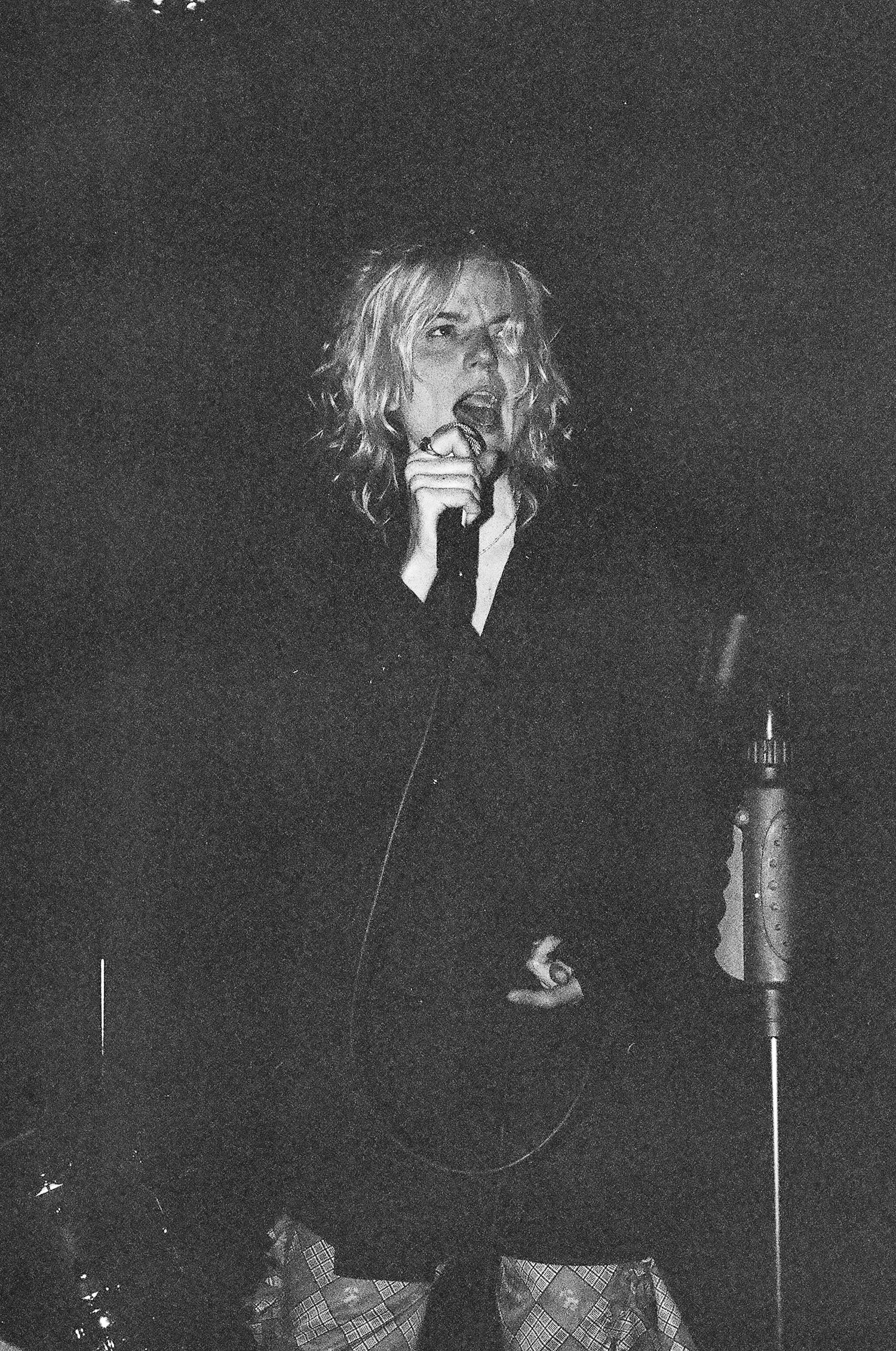 Black and white concert photos showing intense performer movement sequences.