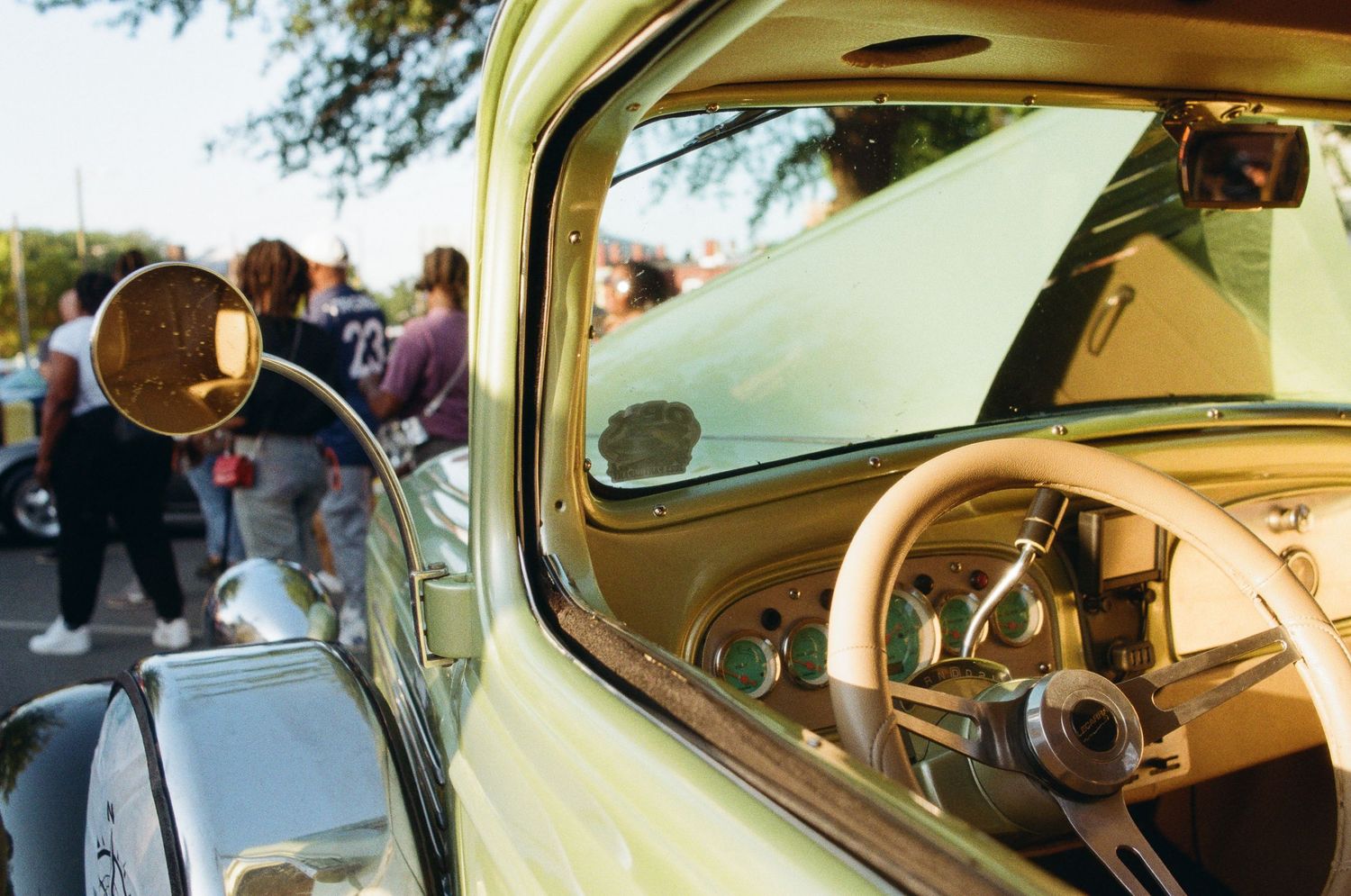 A collage of images showing interior views of a vintage VW Beetle car with dashboard and steering wheel details.