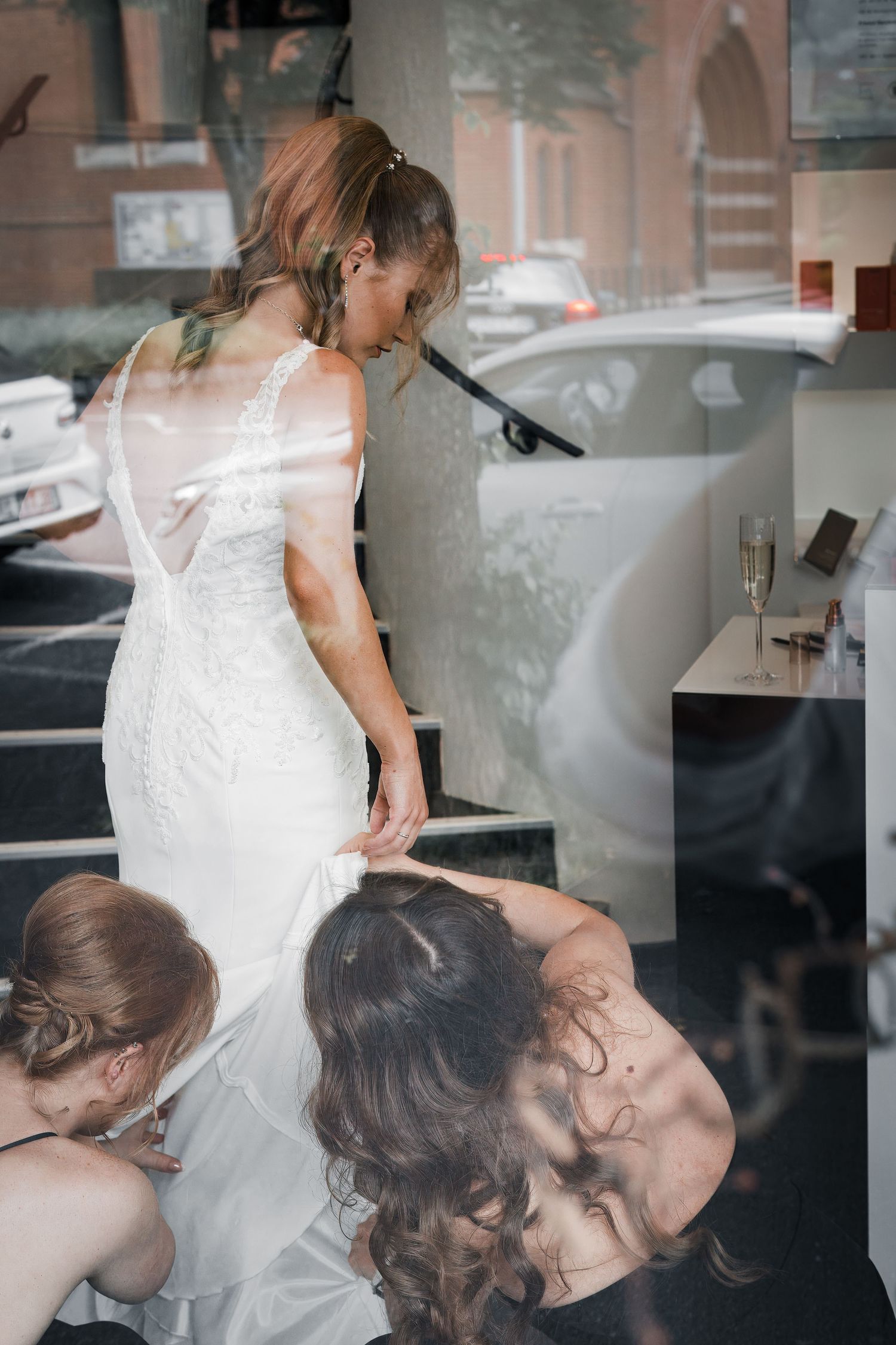 A sequence of candid moments showing a couple in a white dress sharing an intimate embrace in a dimly lit interior setting.