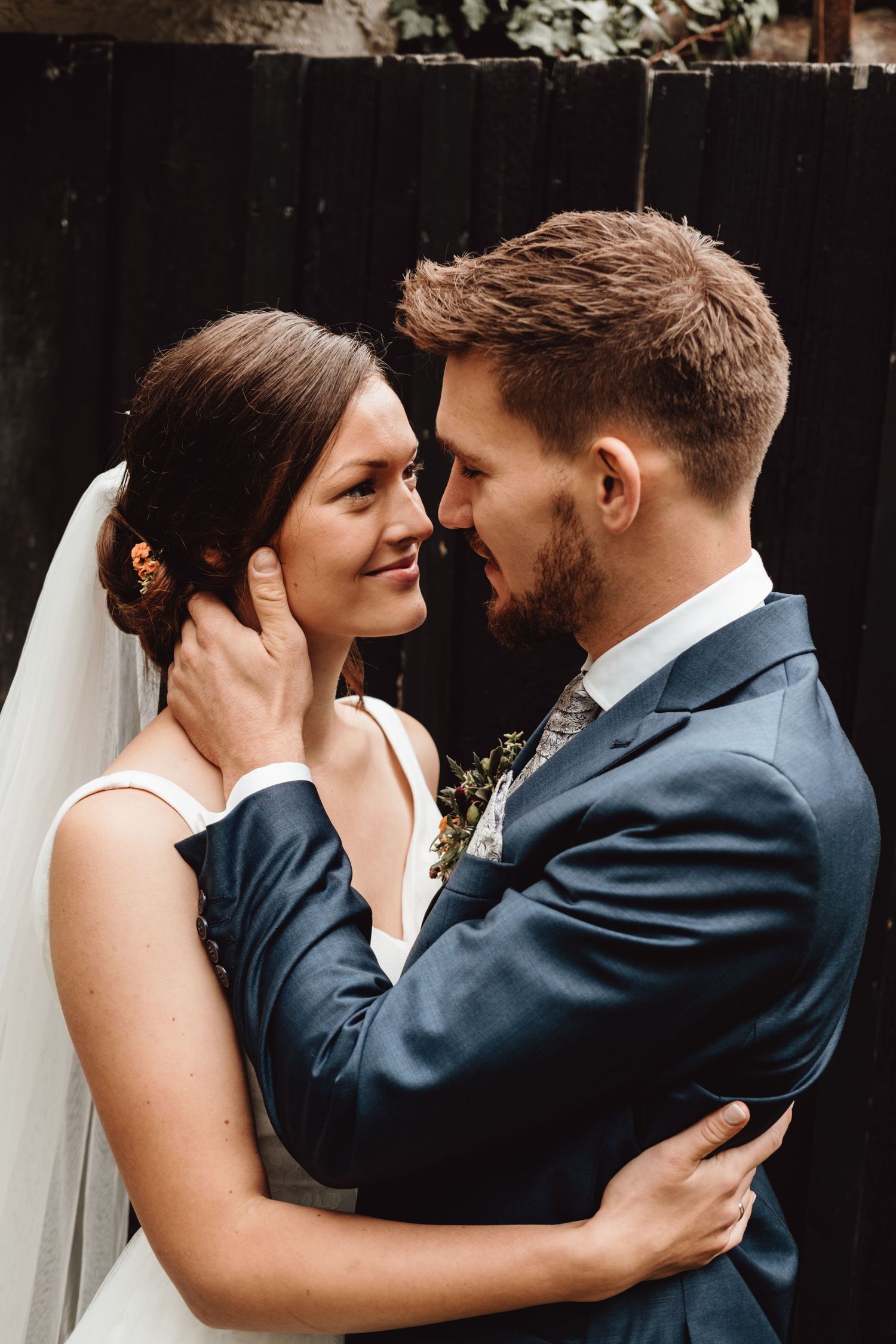 A romantic wedding couple shares intimate moments in a series of black and white photographs.