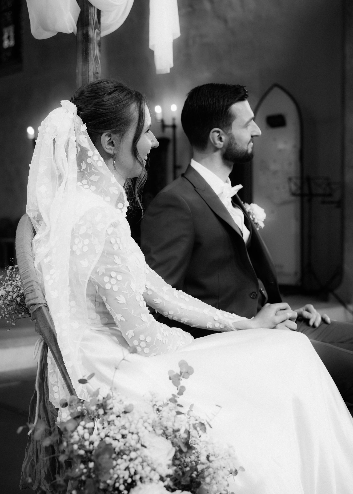A black and white wedding photo collage shows tender moments between a couple in formal attire with baby's breath bouquet.