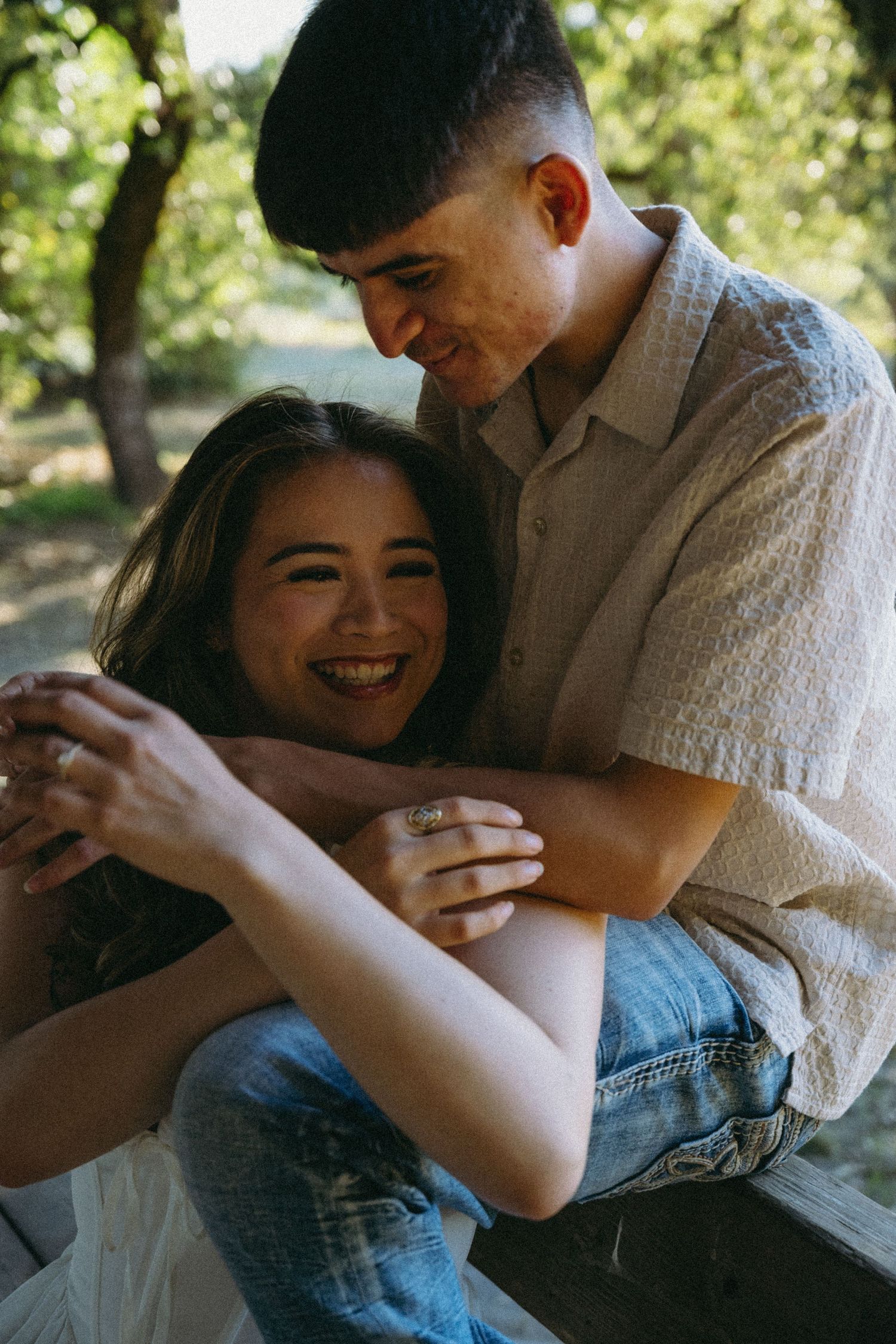 Intimate couple sharing tender moments together in a series of candid outdoor photos.