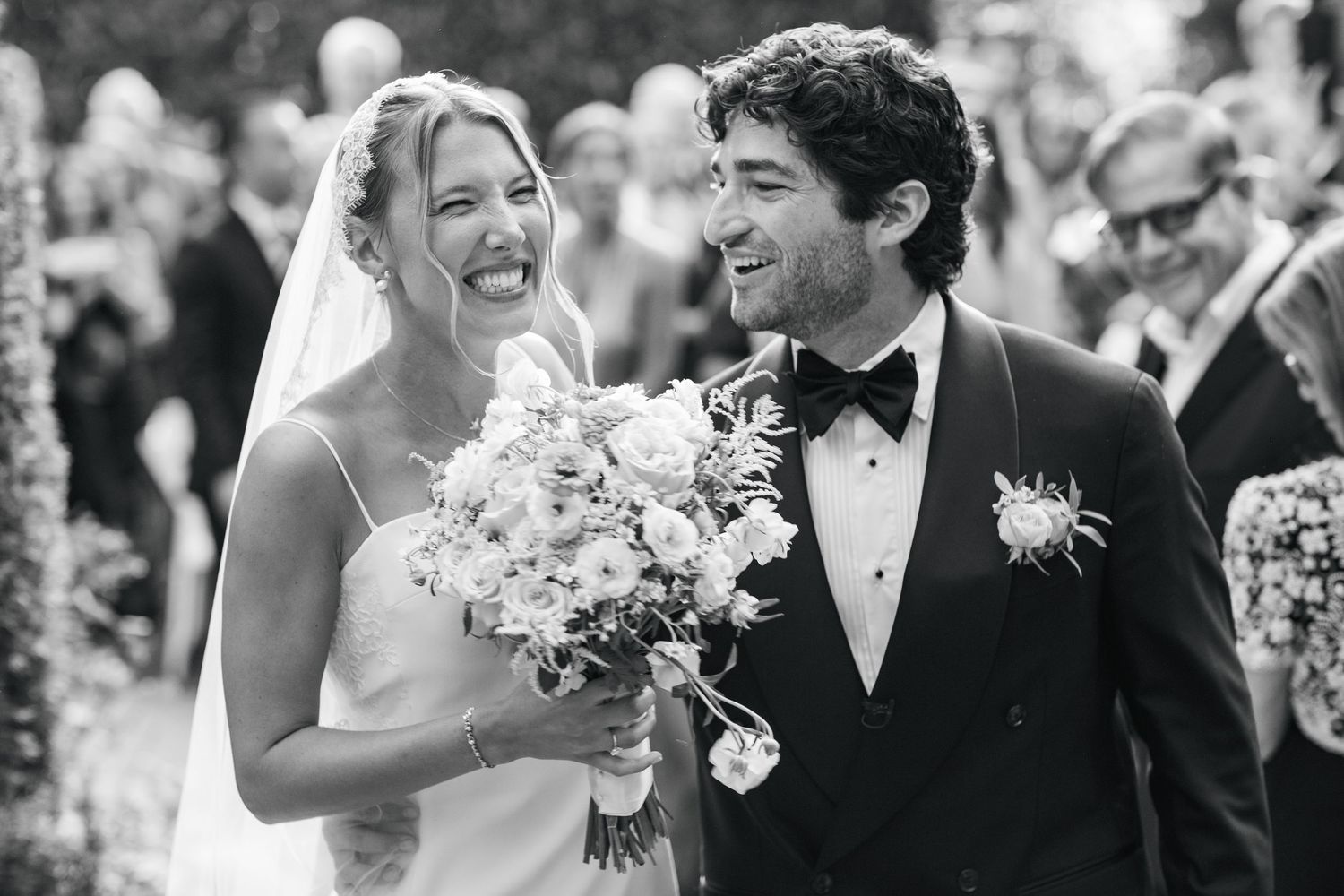 Romantic wedding celebration moments captured in black and white photography.
