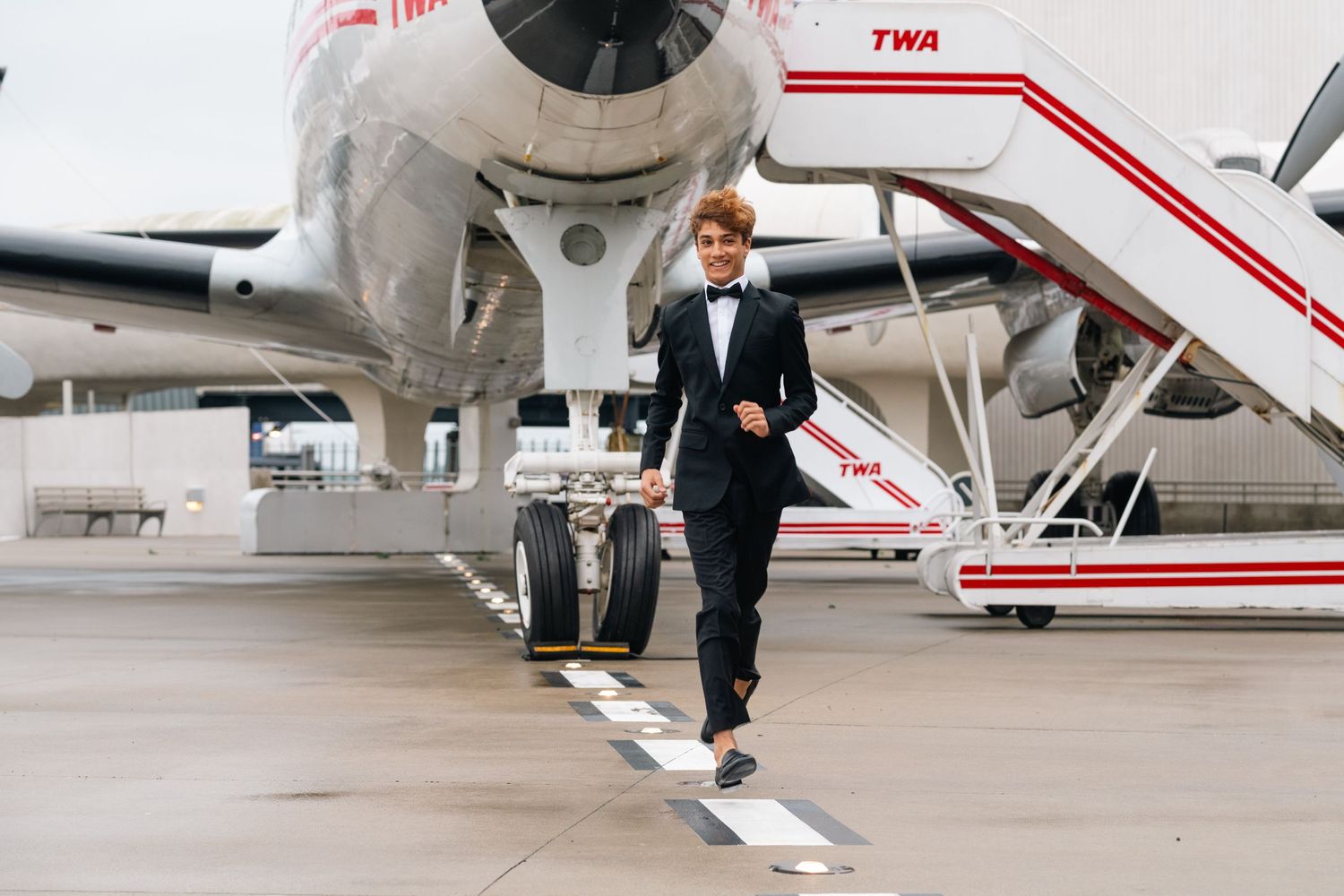Private jet stairs and walkway on airport tarmac with elegant travel details.