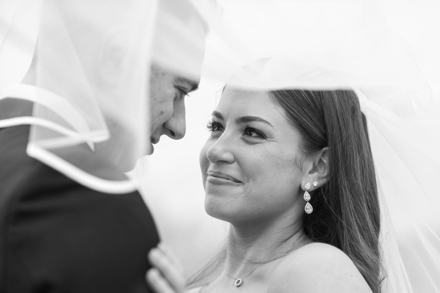 Close-up wedding portrait with soft focus and romantic lighting.