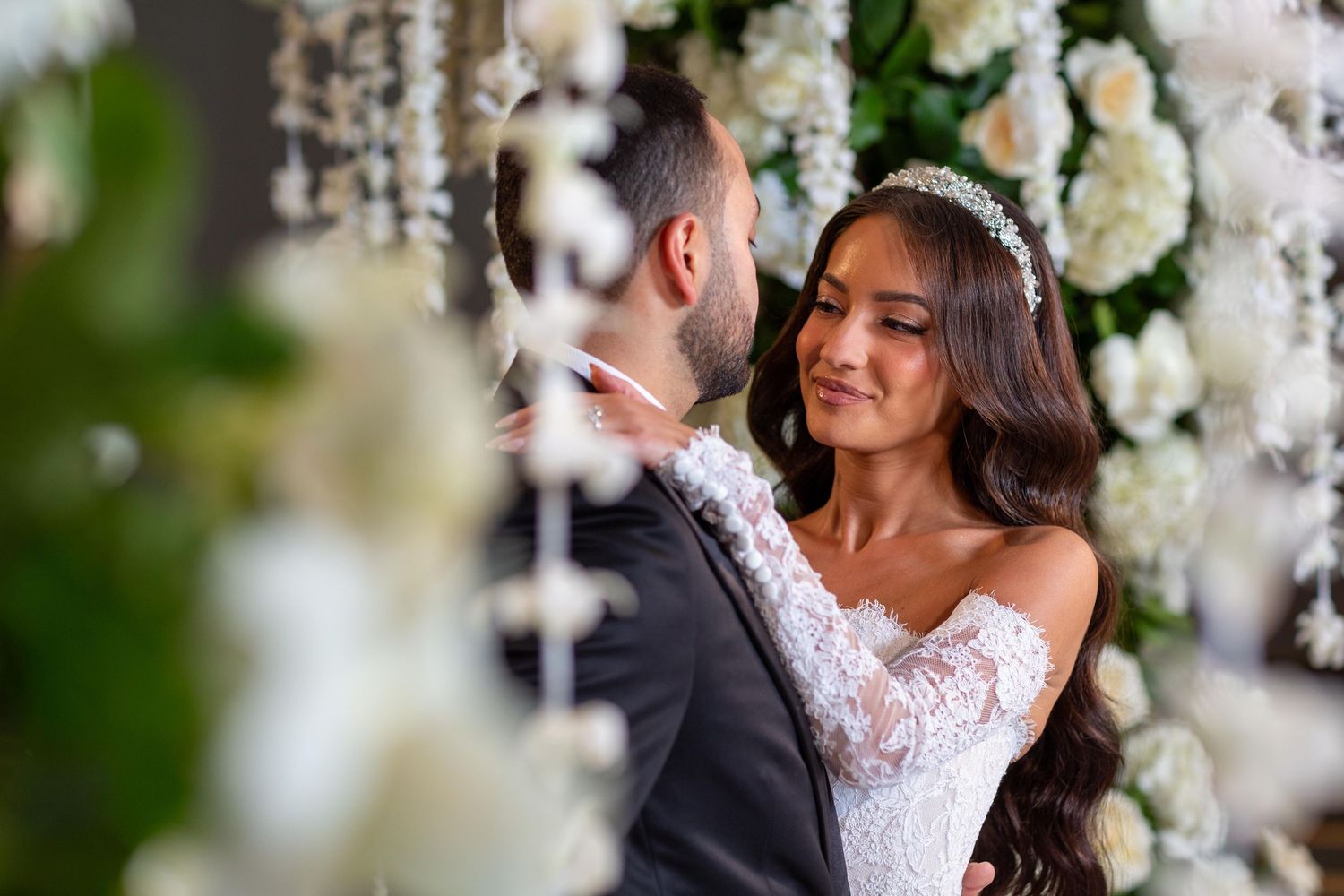Joyful wedding celebration moments captured with white floral decorations.