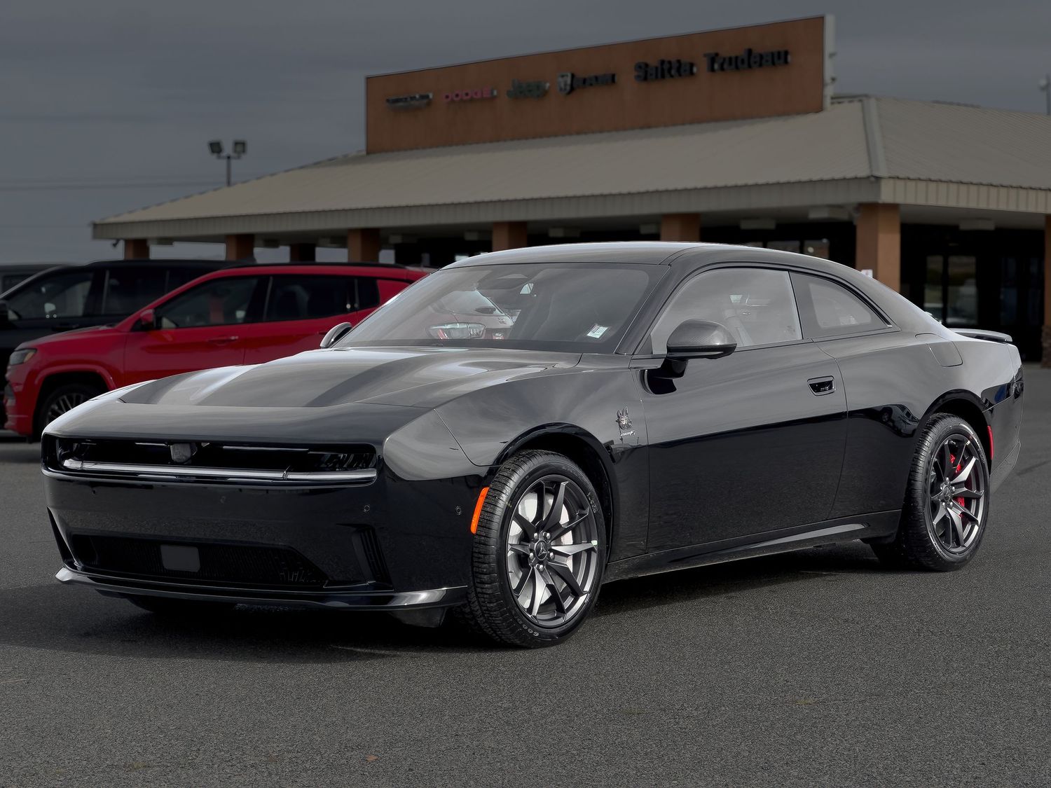 Professional automotive photography of a black all-electric Dodge Charger at a Pahrump Nevada car dealership by Oasis Digital.