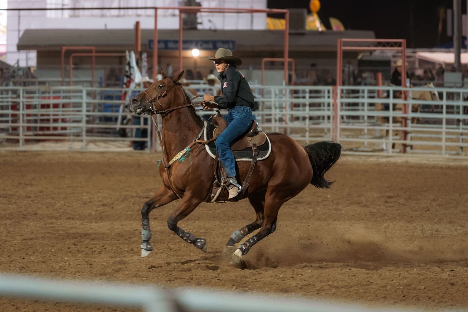 Action photography of a rodeo rider on horseback captured by Oasis Digital.