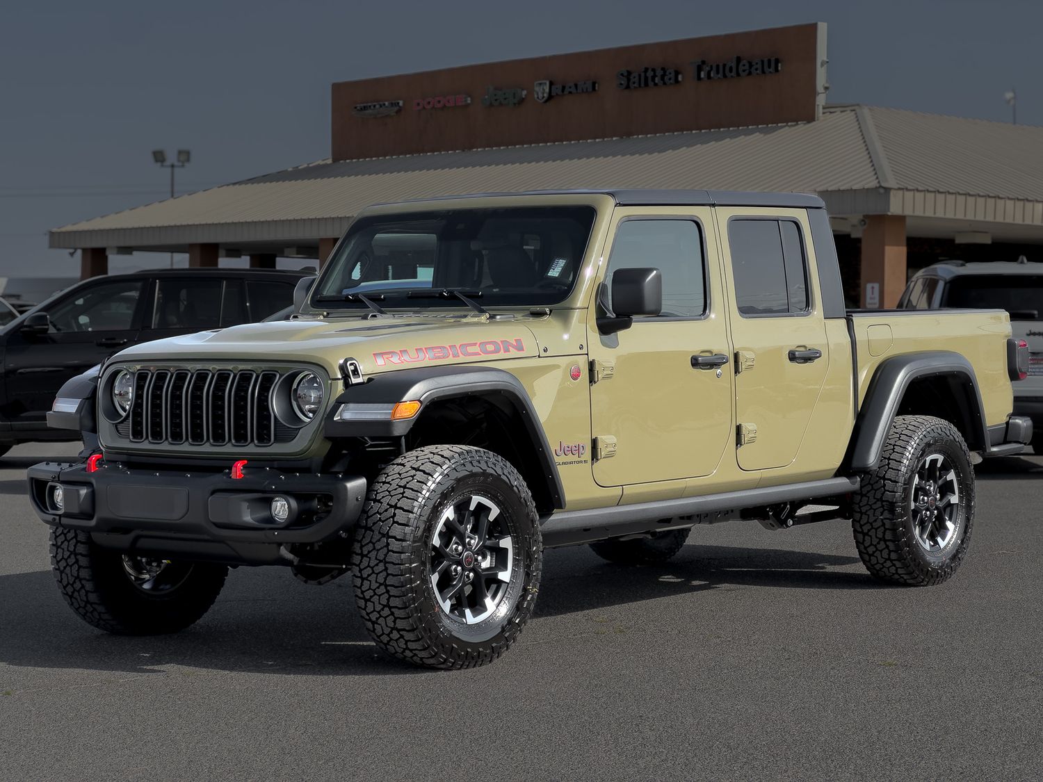 High-quality automotive photo of a new Jeep Gladiator Rubicon in 1941 green at a Pahrump Nevada car dealership by Oasis Digital.