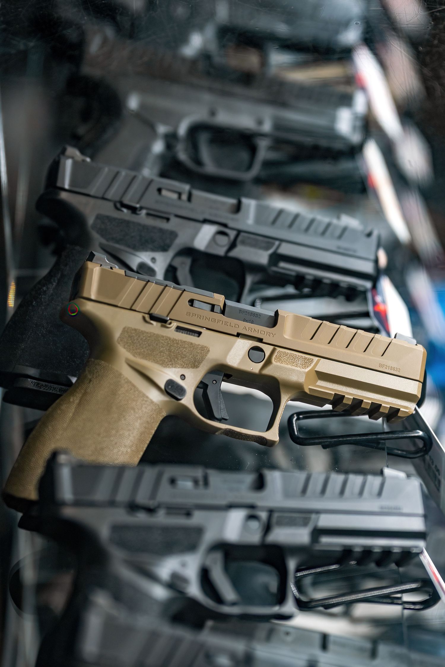 Close-up product photography of handguns and accessories inside a Pahrump Nevada shooting range retail space by Oasis Digital.