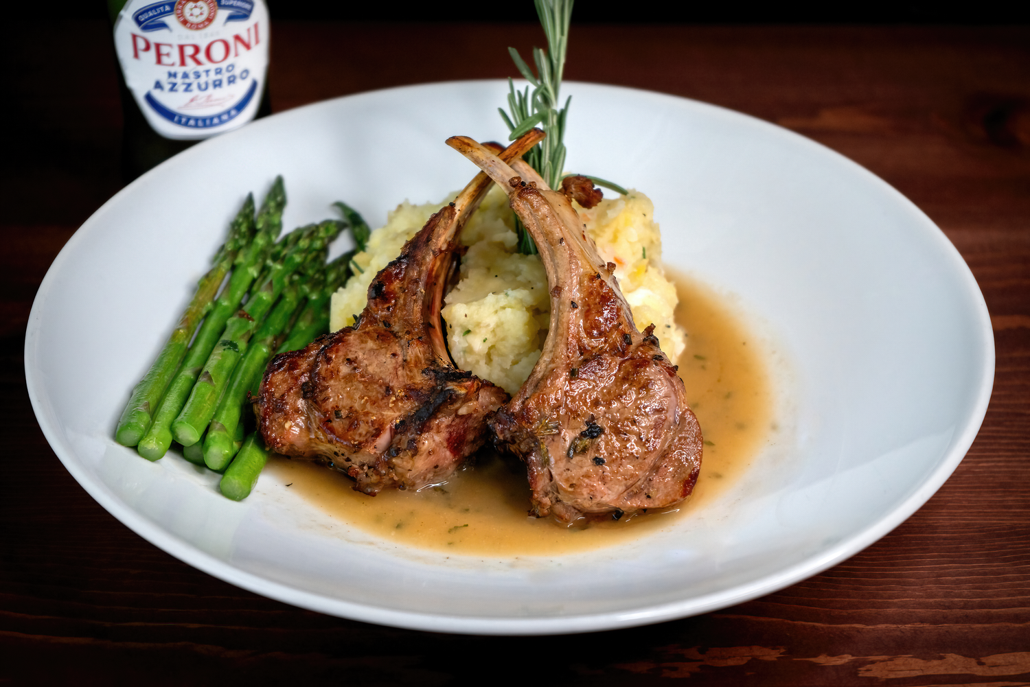 Professional food photography of some lamb chops plated for a Pahrump Nevada restaurant menu by Oasis Digital.