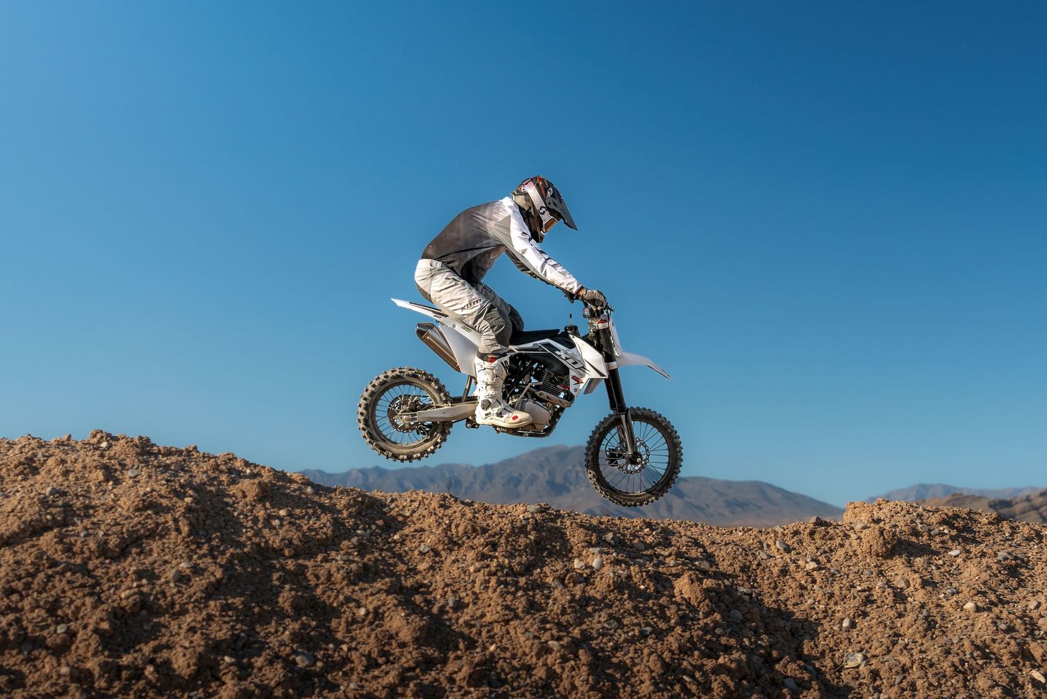 Outdoor photography of a dirt bike rider at an OHV park captured by Oasis Digital.