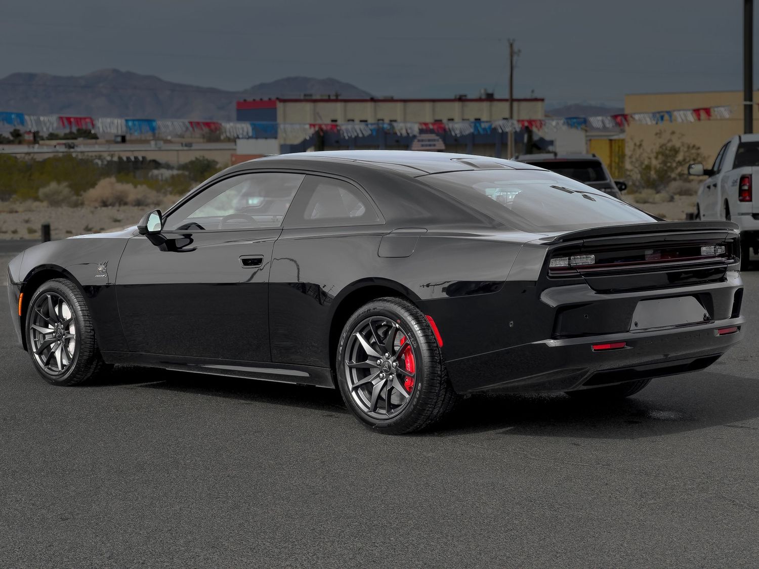 Rear-quarter photo of a new black electric Dodge Charger captured in high detail for dealership marketing by Oasis Digital in Pahrump Nevada