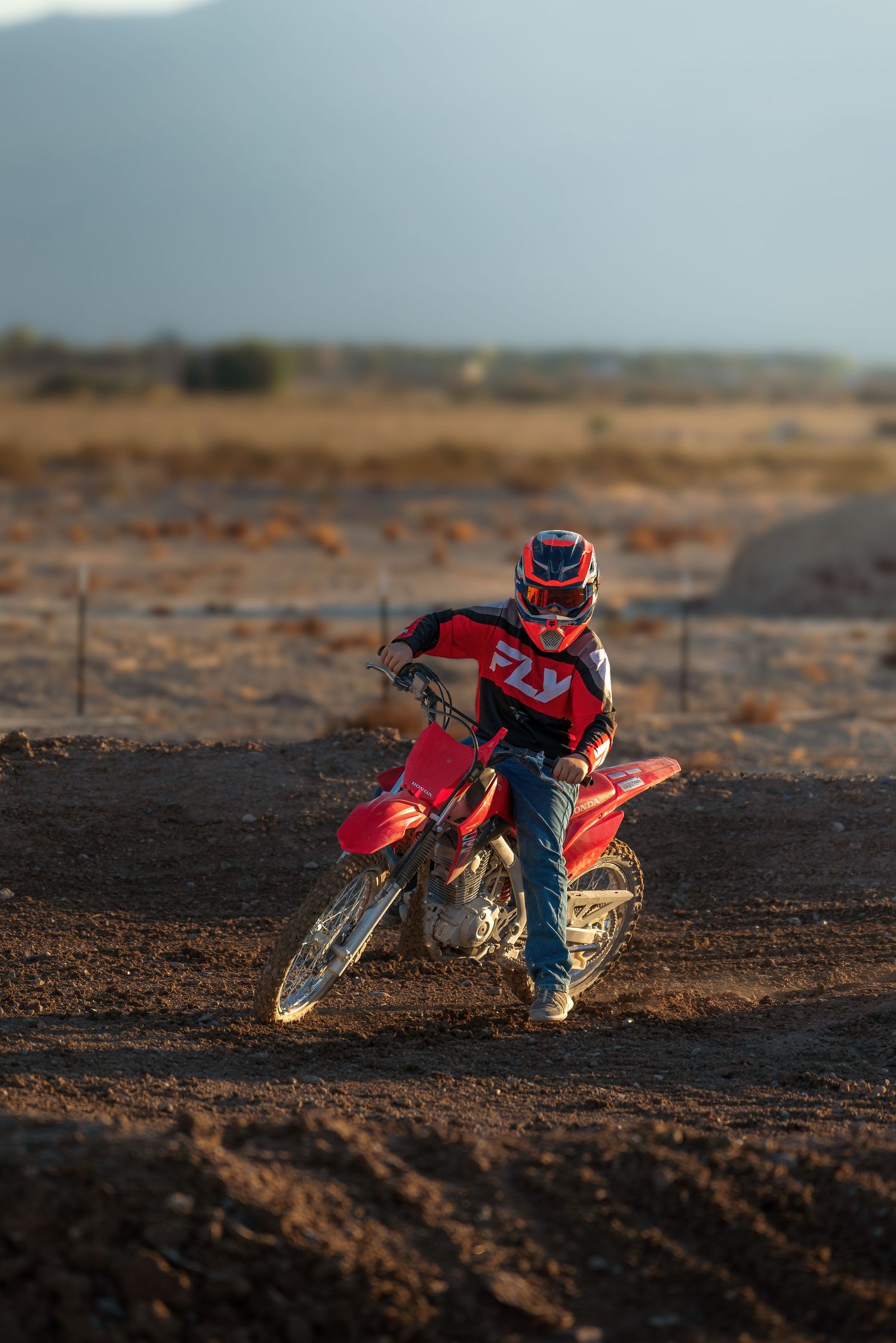 High-energy dirt bike action photo taken for outdoor recreation marketing by Oasis Digital.