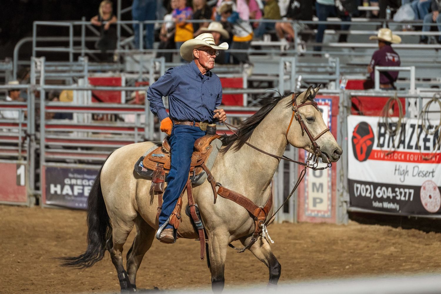 Professional rodeo photo of a cowboy competing on horseback by Oasis Digital.