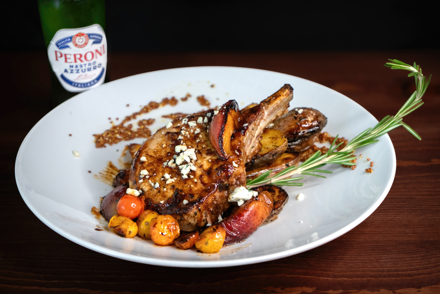 Professional food photography of a center-cut pork chop plated for a Pahrump Nevada restaurant menu by Oasis Digital.