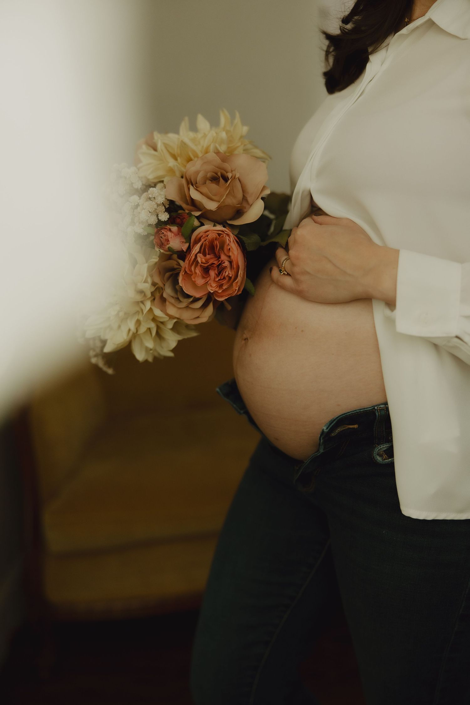 A series of five cropped photos showing a delicate peach-colored rose corsage against a white blouse and dark pants.