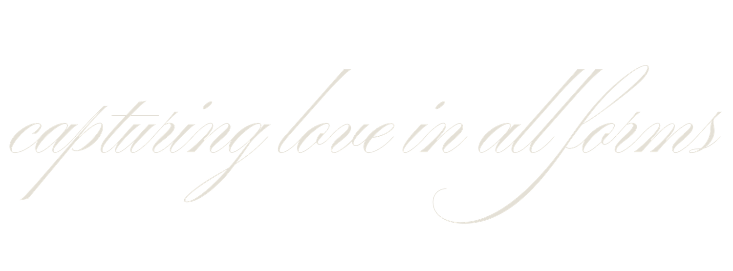 Elegant cursive script reading 'capturing love in all forms' in soft white text on a light background.
