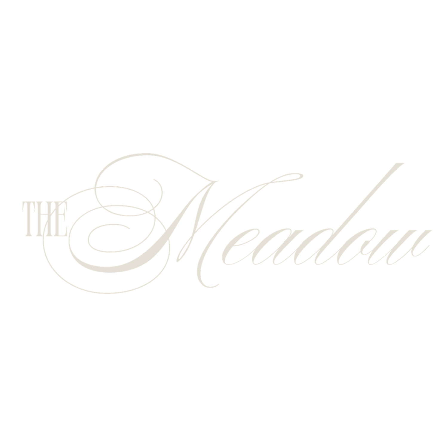 The Meadow elegant script logo in soft ivory tones on a white background.