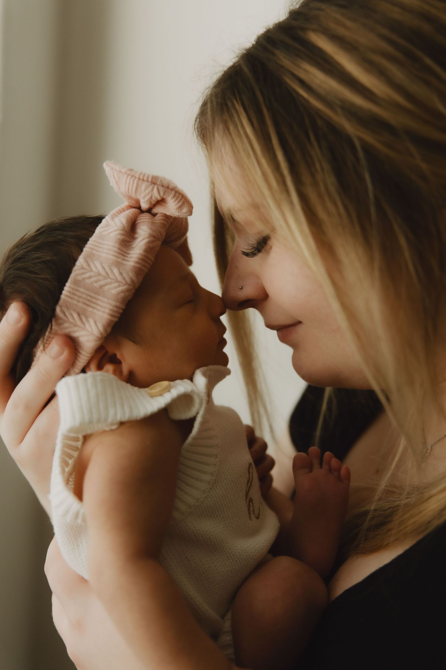 Intimate lifestyle portrait showing tender moment in warm natural lighting.