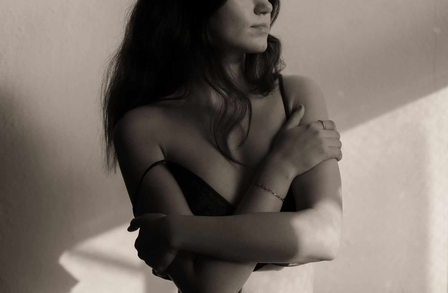 A series of seven black and white artistic portraits showing silhouettes and shadows in dramatic lighting.
